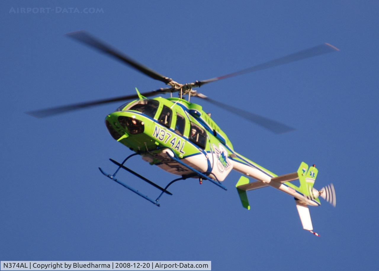N374AL, 2008 Bell 407 C/N 53819, AirLife Denver heading West over Columbine High School Littleton, Colorado.