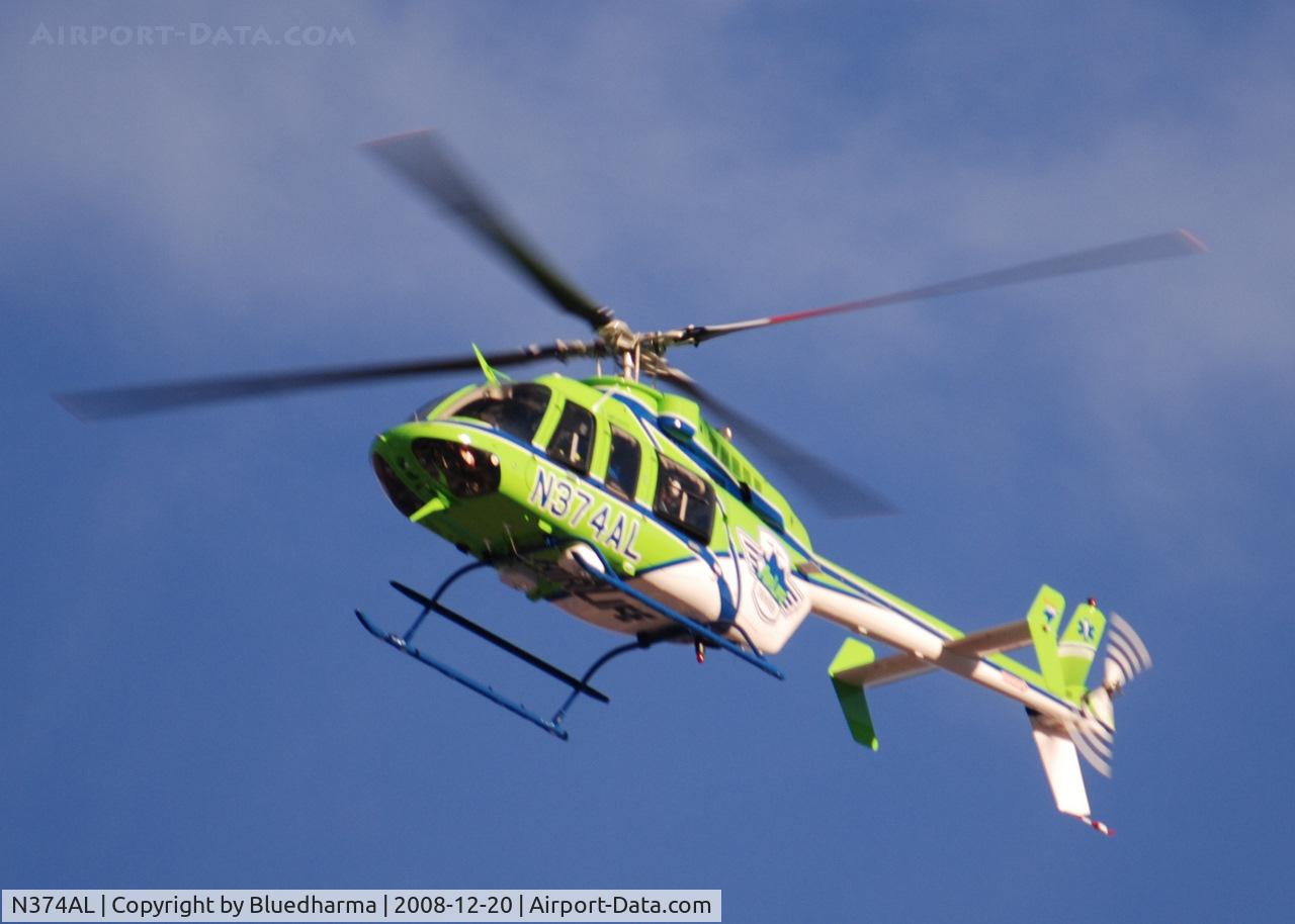 N374AL, 2008 Bell 407 C/N 53819, AirLife Denver heading West over Columbine High School Littleton, Colorado.