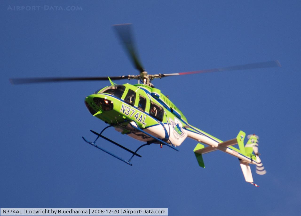 N374AL, 2008 Bell 407 C/N 53819, AirLife Denver heading West over Columbine High School Littleton, Colorado.