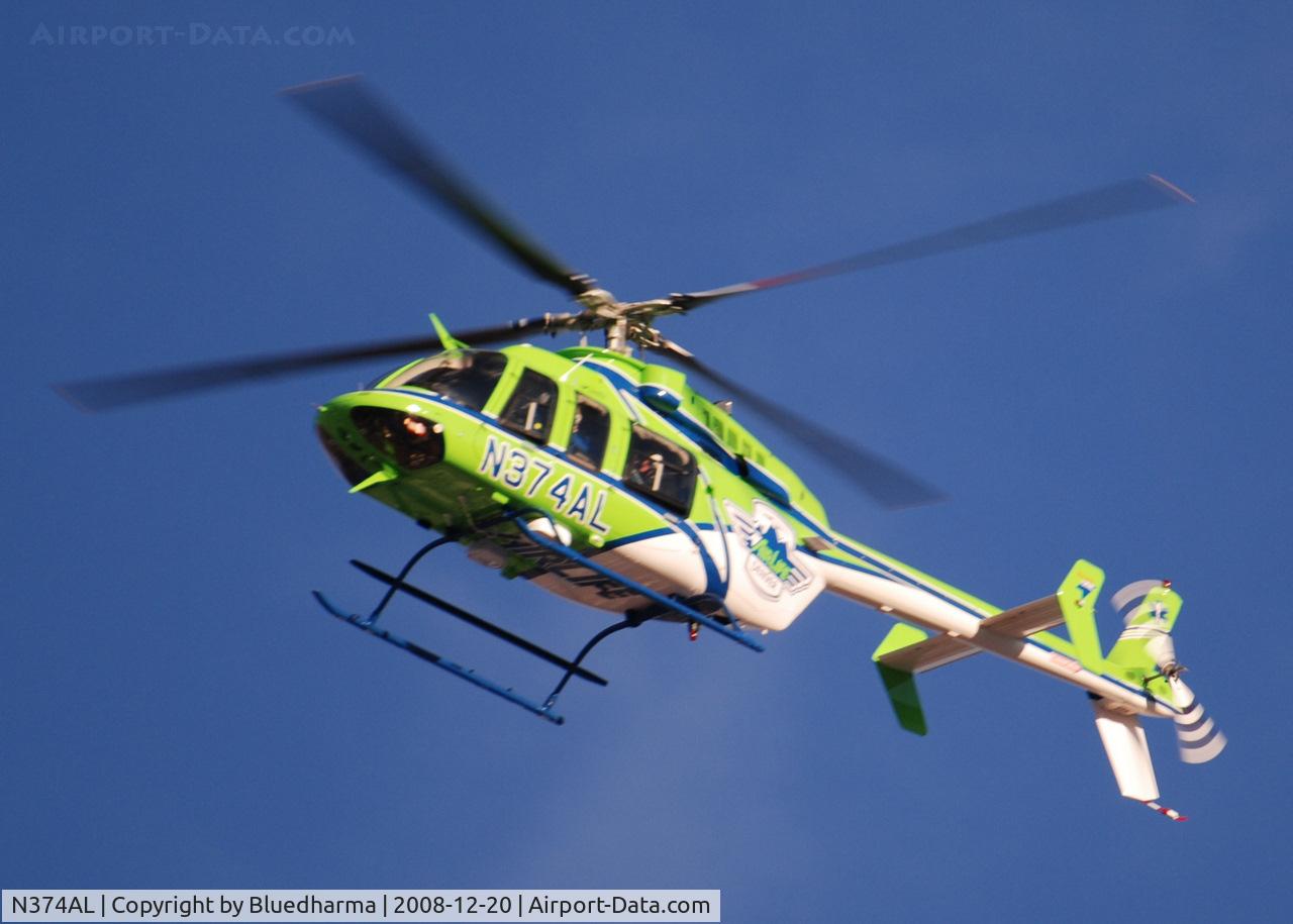 N374AL, 2008 Bell 407 C/N 53819, AirLife Denver heading West over Columbine High School Littleton, Colorado.
