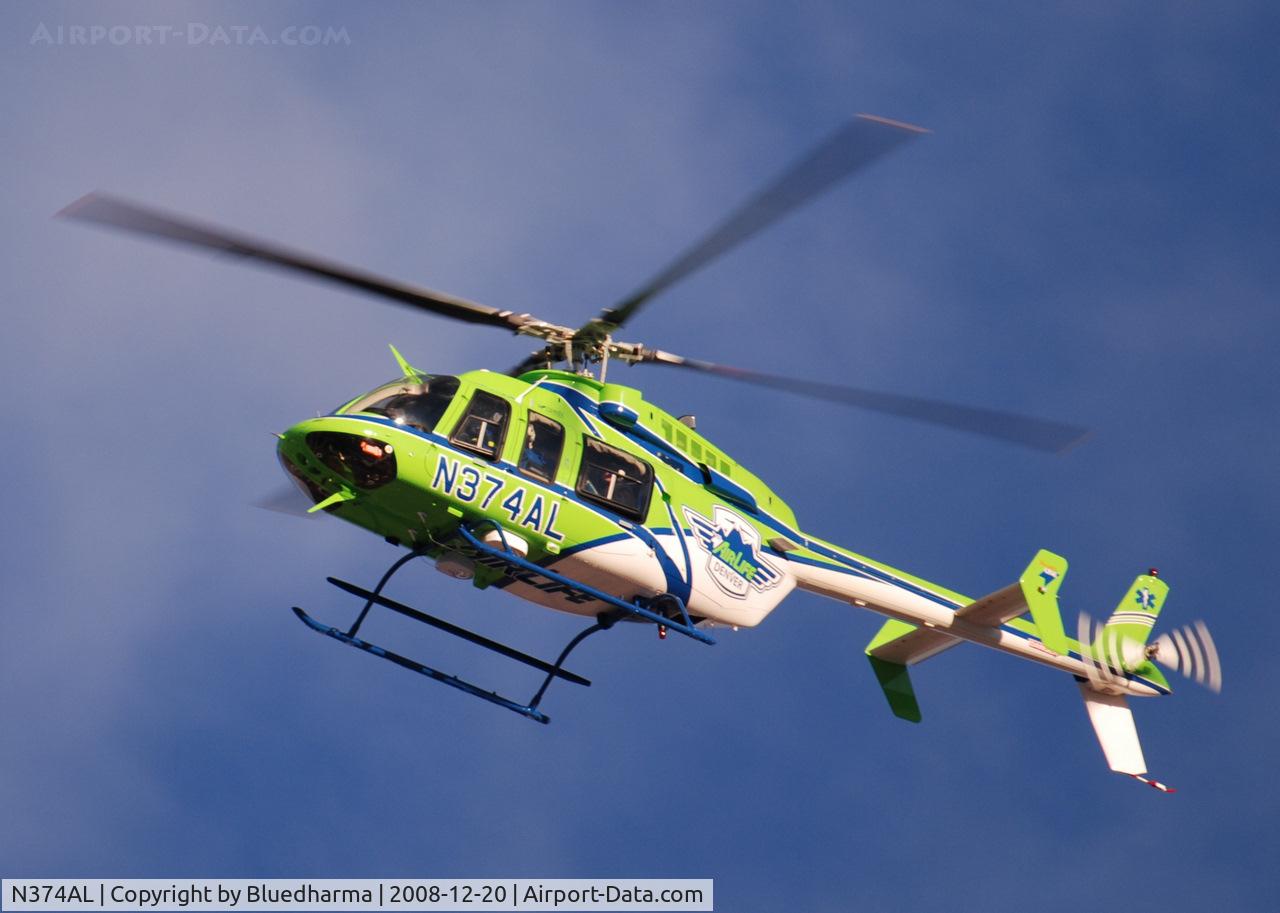 N374AL, 2008 Bell 407 C/N 53819, AirLife Denver heading West over Columbine High School Littleton, Colorado.