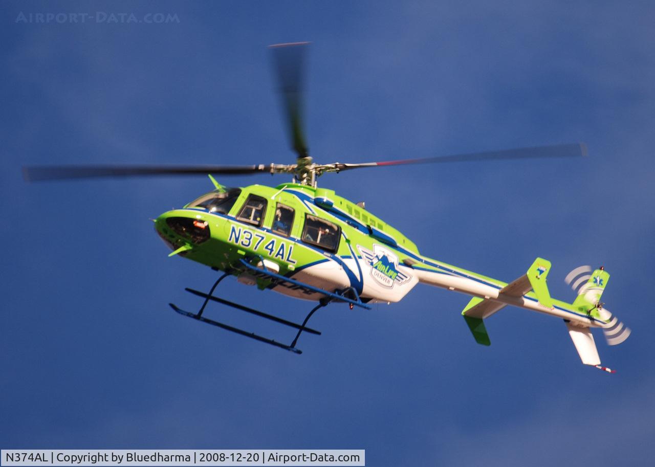 N374AL, 2008 Bell 407 C/N 53819, AirLife Denver heading West over Columbine High School Littleton, Colorado.