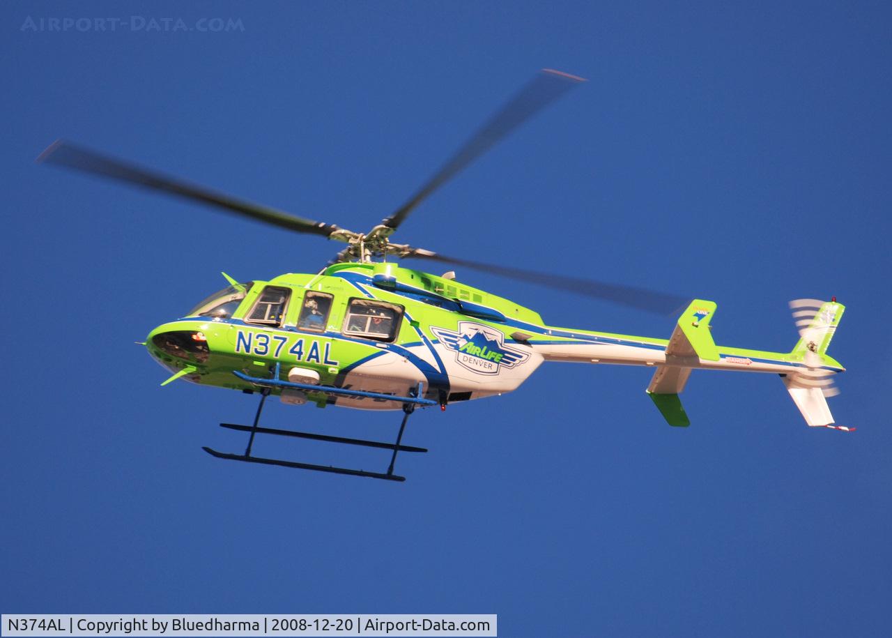N374AL, 2008 Bell 407 C/N 53819, AirLife Denver heading West over Columbine High School Littleton, Colorado.