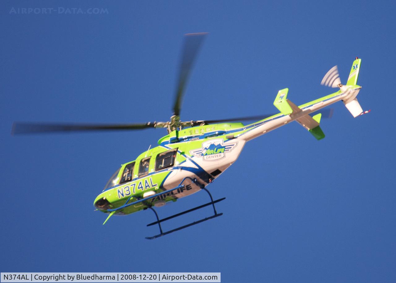 N374AL, 2008 Bell 407 C/N 53819, AirLife Denver heading West over Columbine High School Littleton, Colorado.
