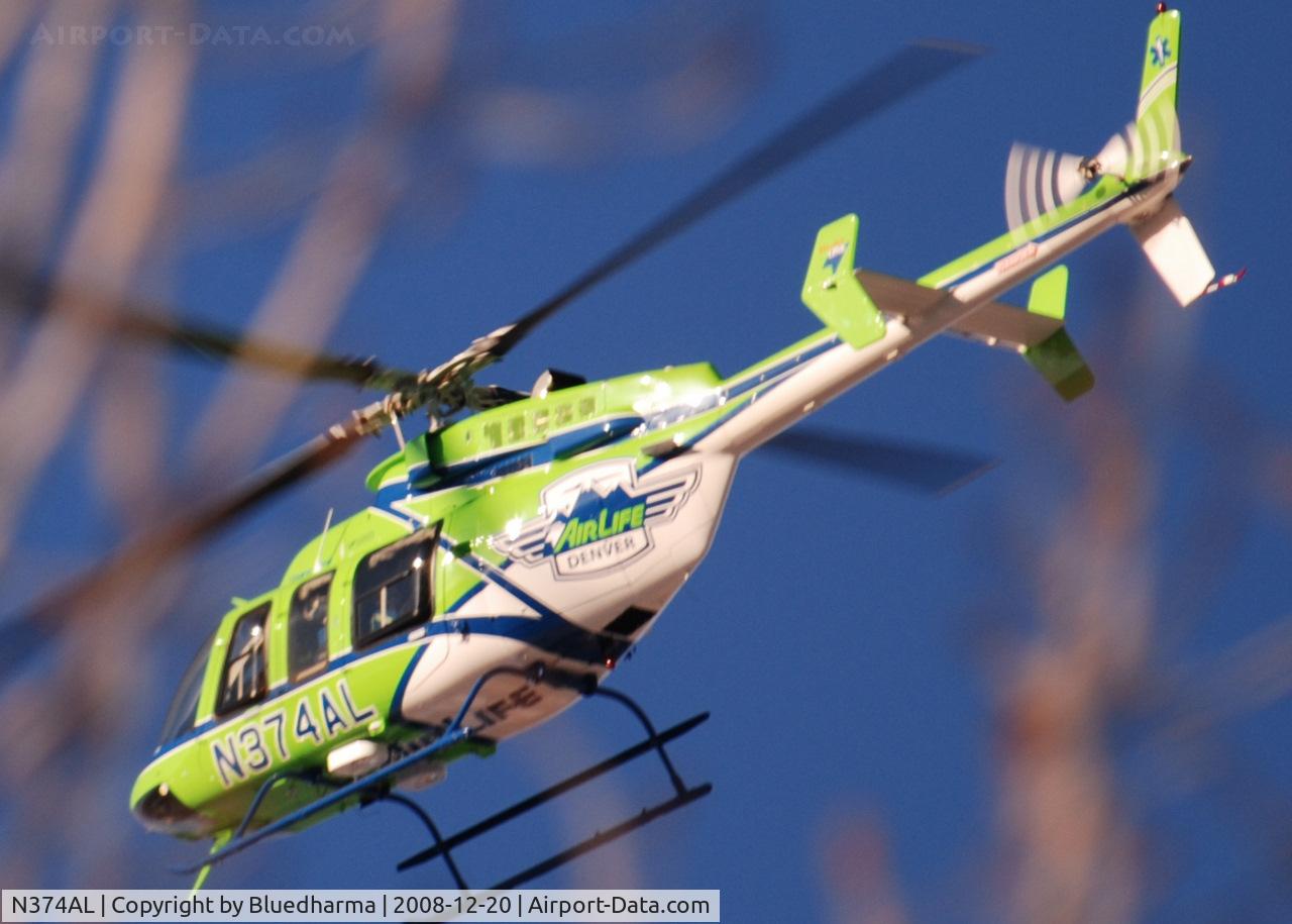 N374AL, 2008 Bell 407 C/N 53819, AirLife Denver heading West over Columbine High School Littleton, Colorado.