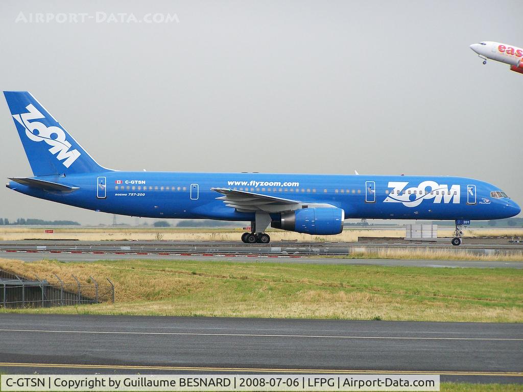 C-GTSN, 1990 Boeing 757-28A C/N 24543, Just landed 27R, with Easy 737 taking off behind. I was happy to catch them, as the airline drowned a few days after.