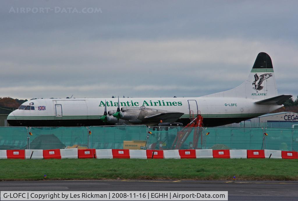 G-LOFC, 1959 Lockheed L-188C(F) Electra C/N 1100, Atlantic Airlines next to the airport works