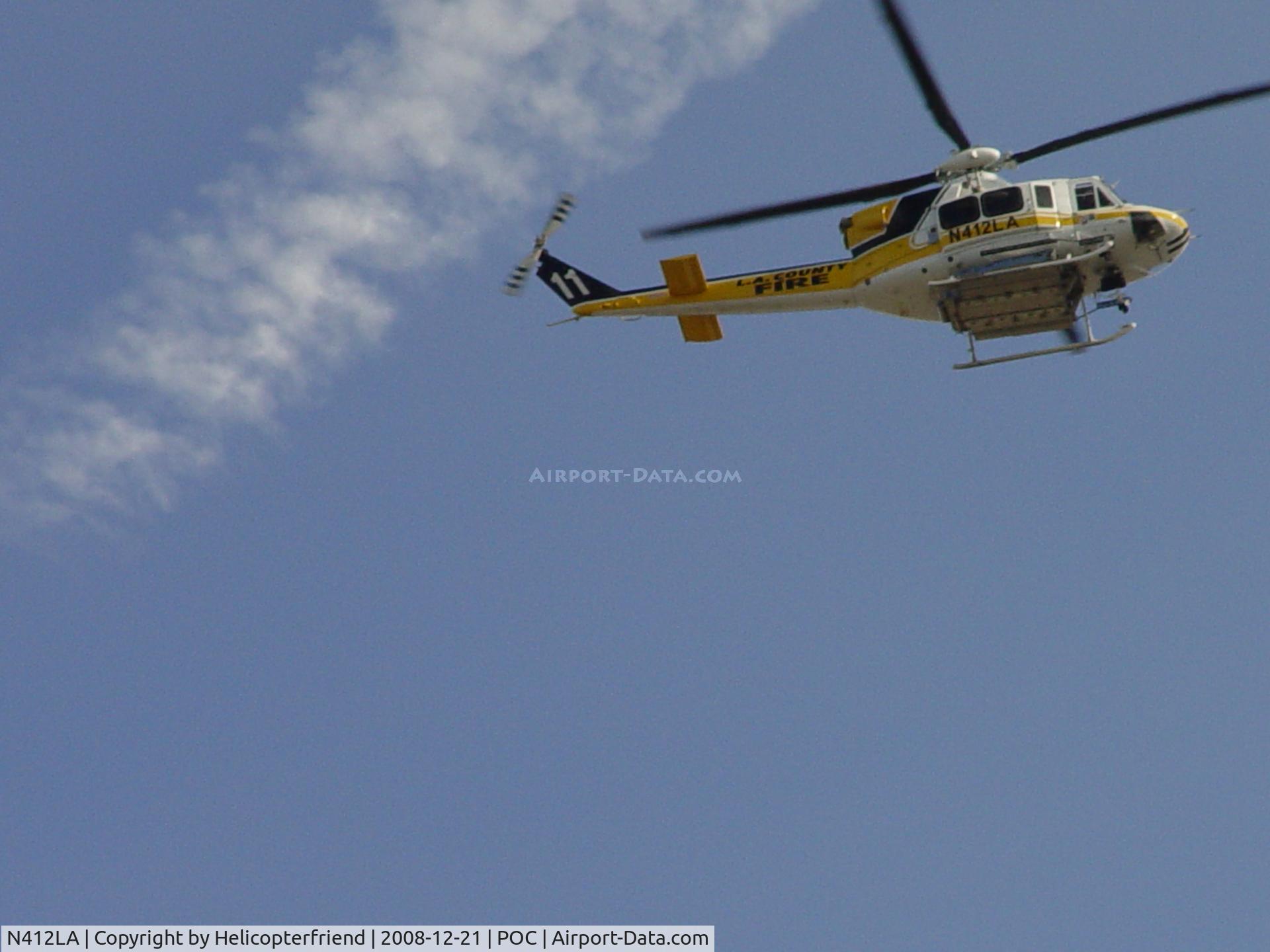 N412LA, 2005 Bell 412EP C/N 36392, Passing overhead enroute to Heliapad at EHA