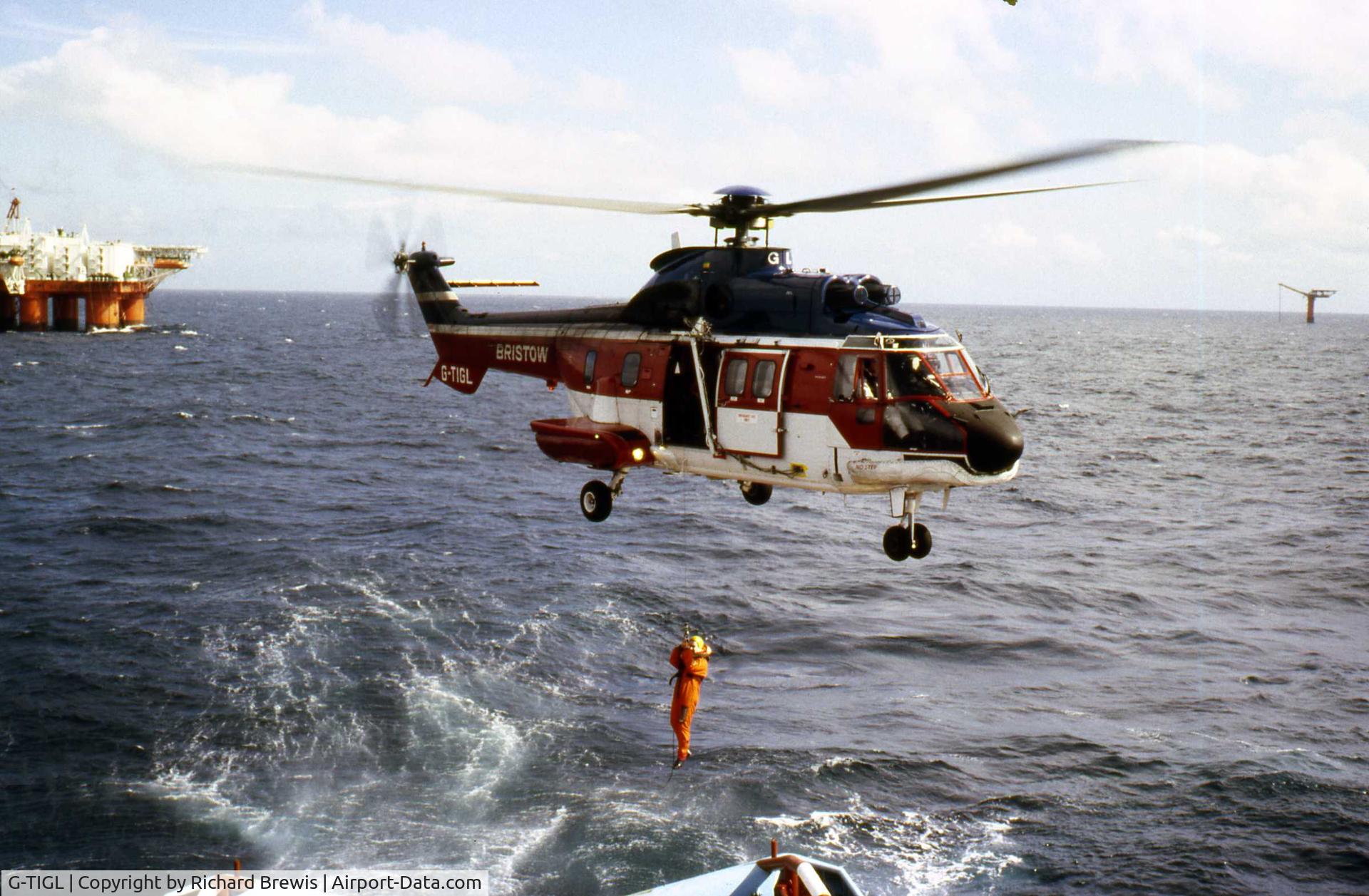 G-TIGL, 1982 Aérospatiale AS-332L Super Puma C/N 2050, G-TIGL lifting crew member off Maersk Rover 1989