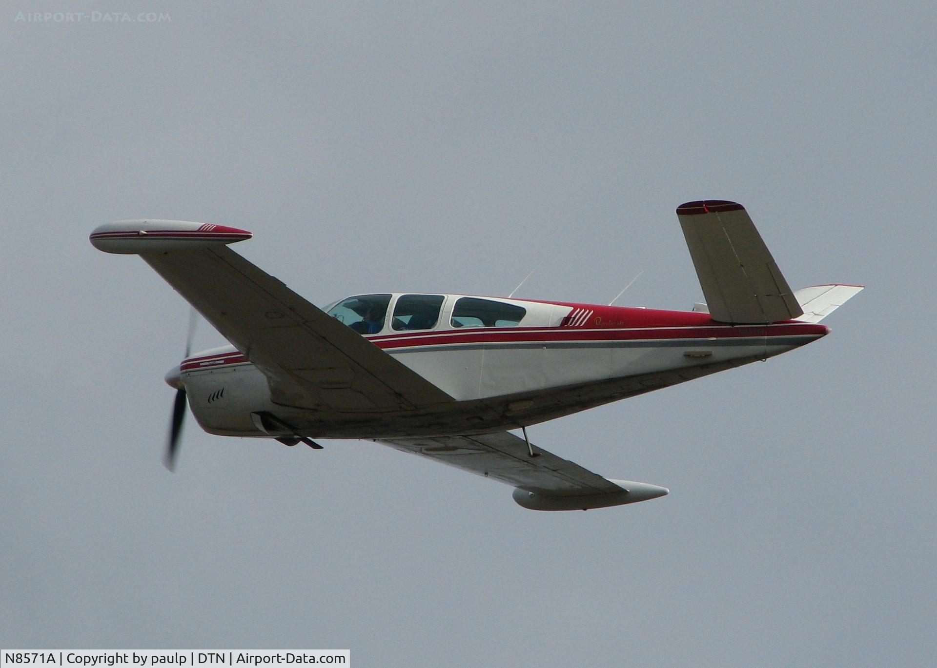 N8571A, 1949 Beech A35 Bonanza C/N D-1993, Taking off from the Downtown Shreveport airport.