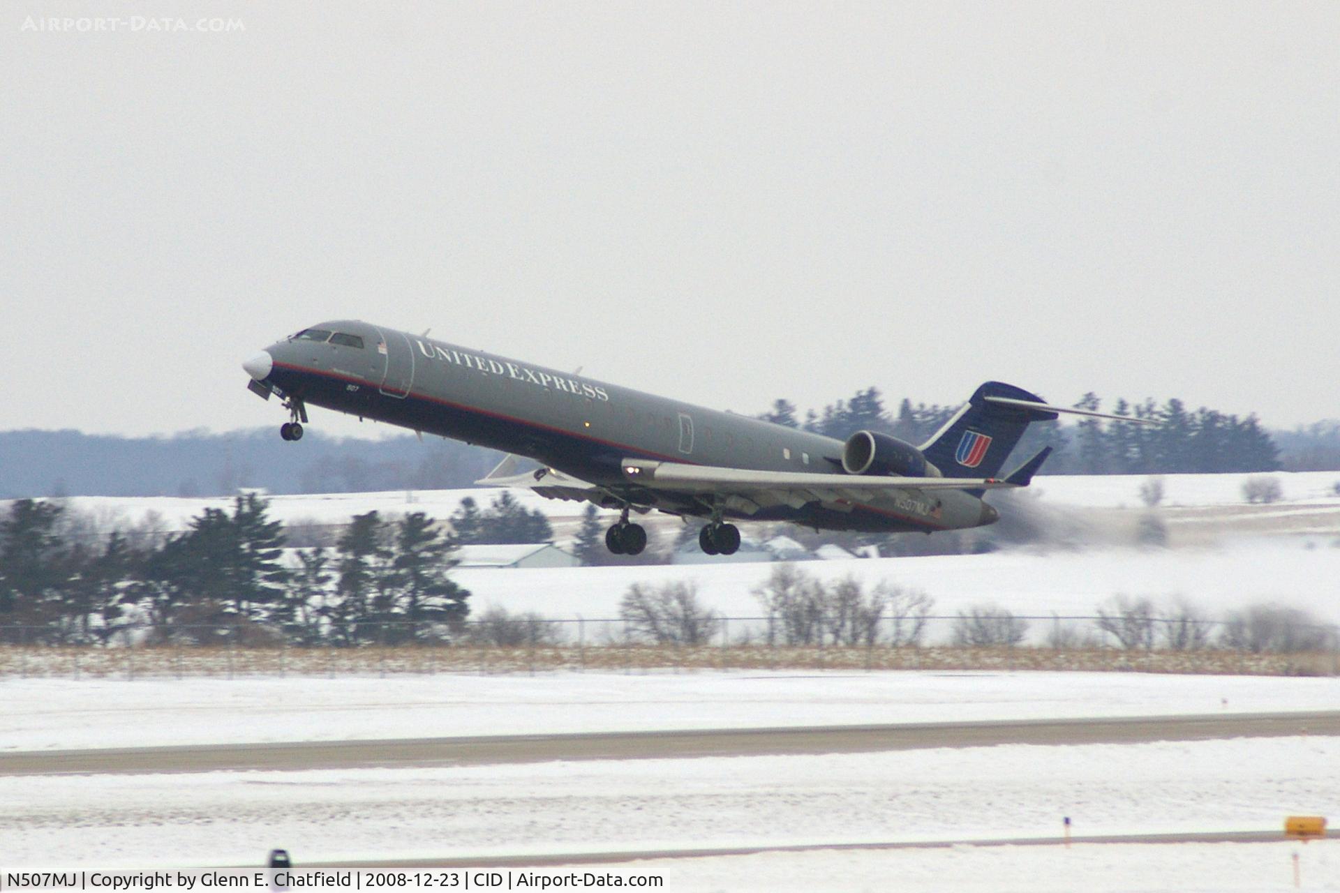 N507MJ, 2003 Bombardier CRJ-701 (CL-600-2C10) Regional Jet C/N 10017, Departing Runway 9.  On the way to O'Hare International