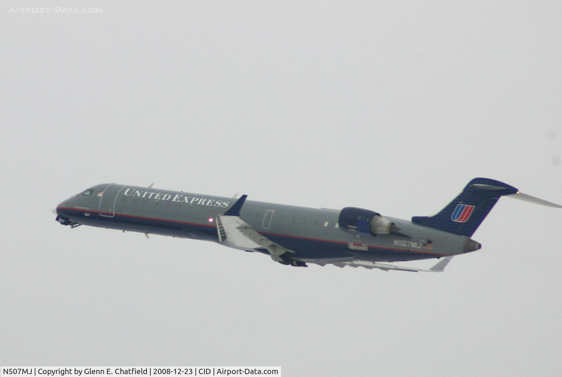 N507MJ, 2003 Bombardier CRJ-701 (CL-600-2C10) Regional Jet C/N 10017, Departing Runway 9.  On the way to O'Hare International