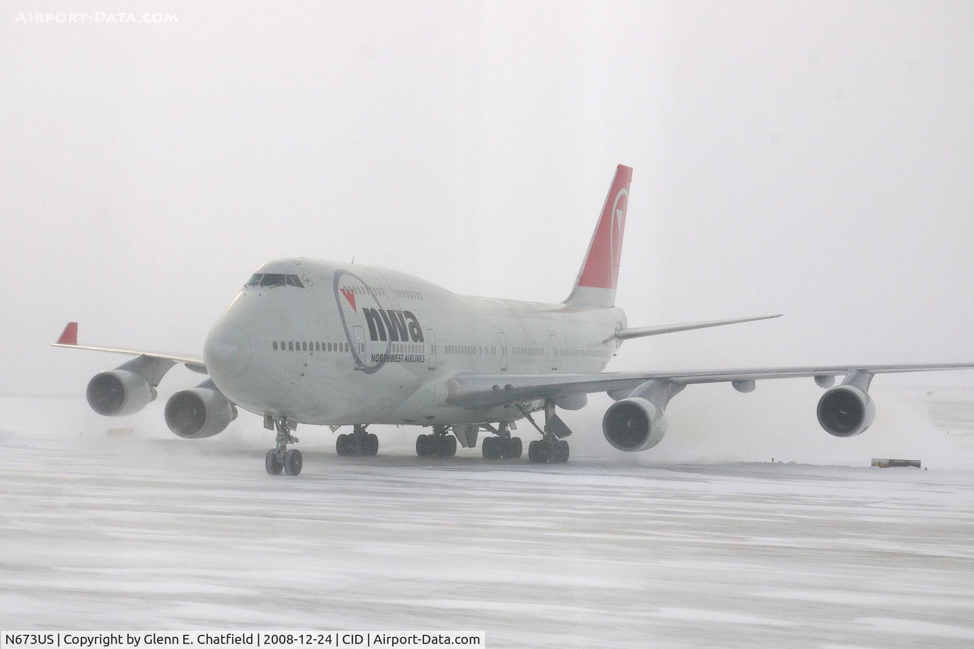 N673US, 1999 Boeing 747-451 C/N 30268, NWA9840  taxiing to the cargo ramp.  Seen from my 2nd floor office window