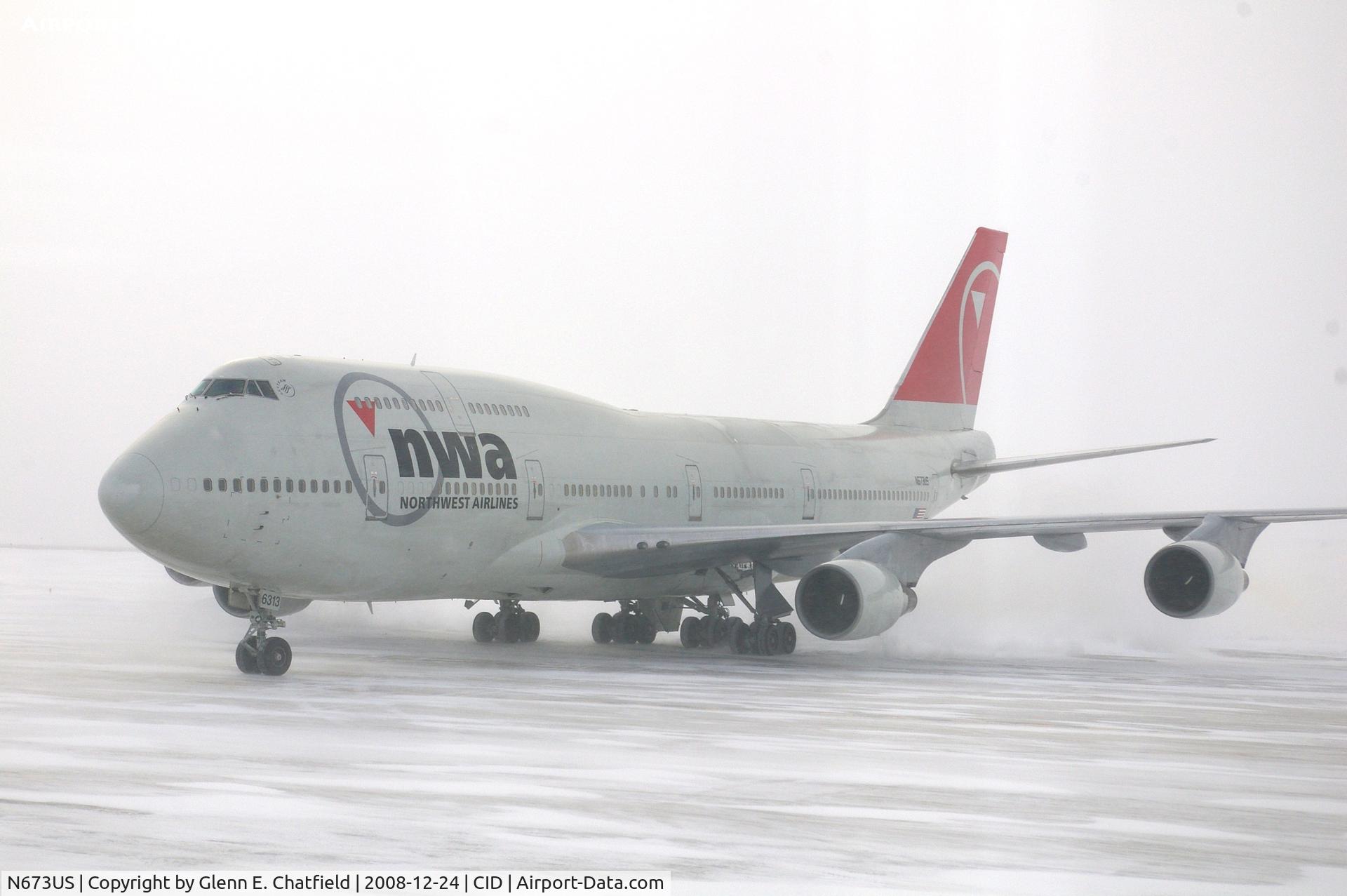 N673US, 1999 Boeing 747-451 C/N 30268, NWA9840  taxiing to the cargo ramp.  Seen from my 2nd floor office window