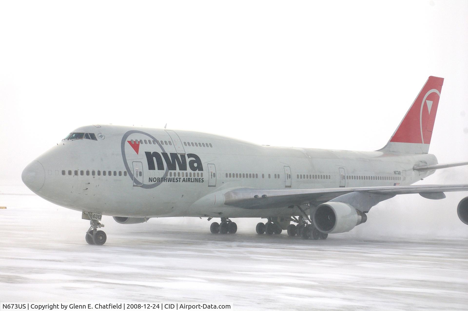 N673US, 1999 Boeing 747-451 C/N 30268, NWA9840  taxiing to the cargo ramp.  Seen from my 2nd floor office window