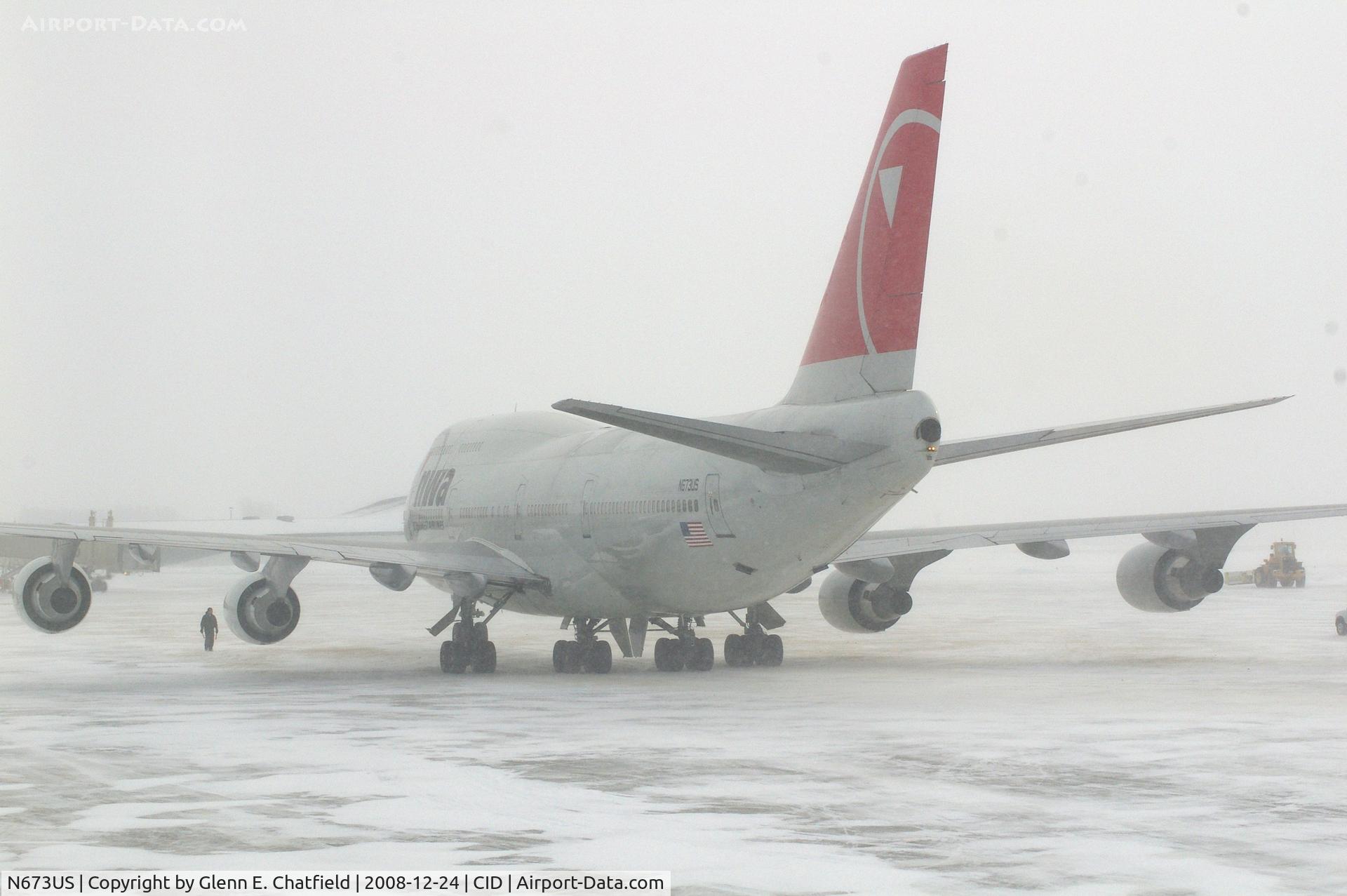 N673US, 1999 Boeing 747-451 C/N 30268, NWA9840 parked the cargo ramp.  Seen from my 2nd floor office window, very snowy