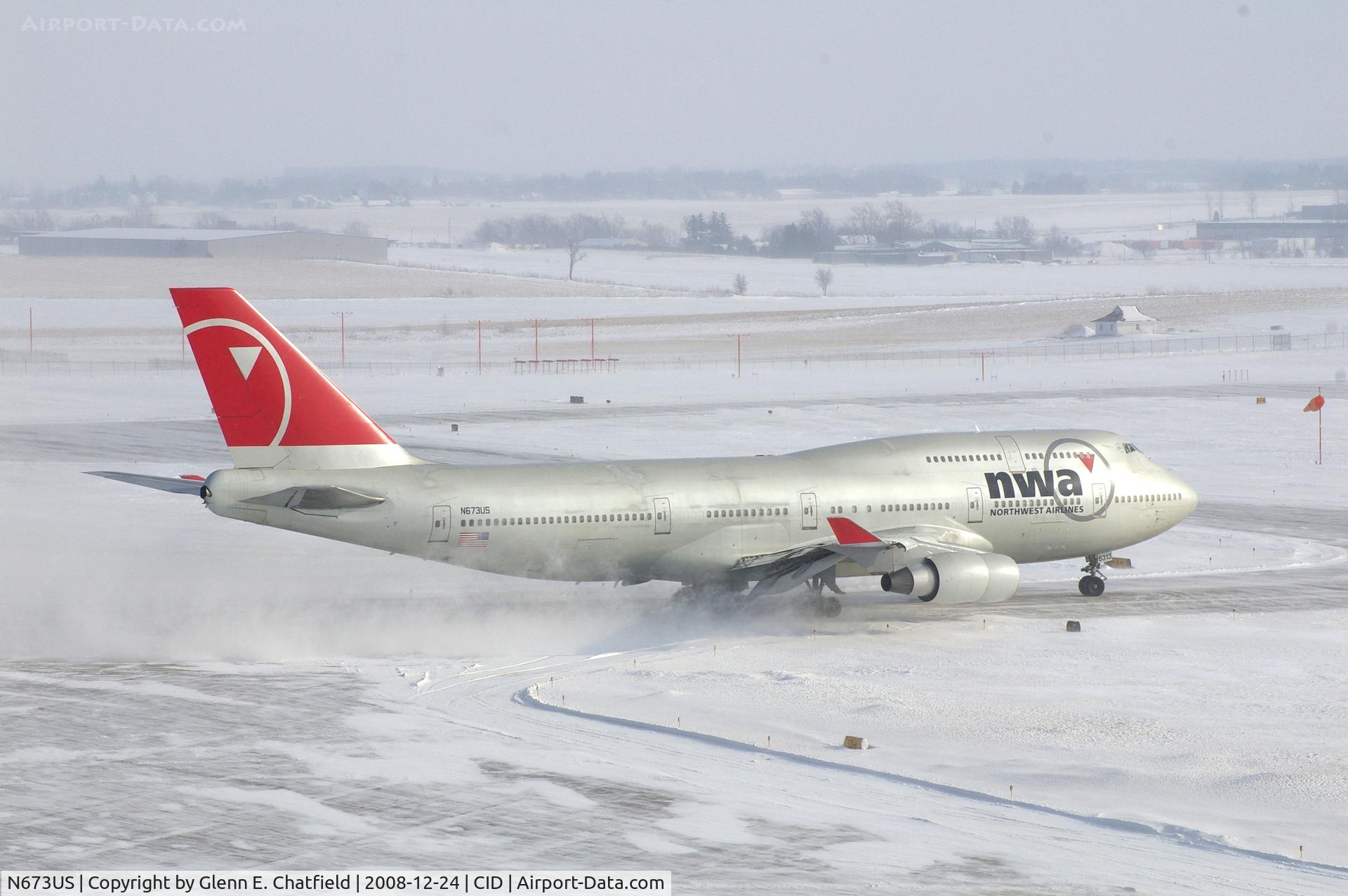 N673US, 1999 Boeing 747-451 C/N 30268, NWA9980 taxiing to Runway 27, on taxiway Alpha 5.  Wind 280@25-30 kt and I'm outside on the tower catwalk
