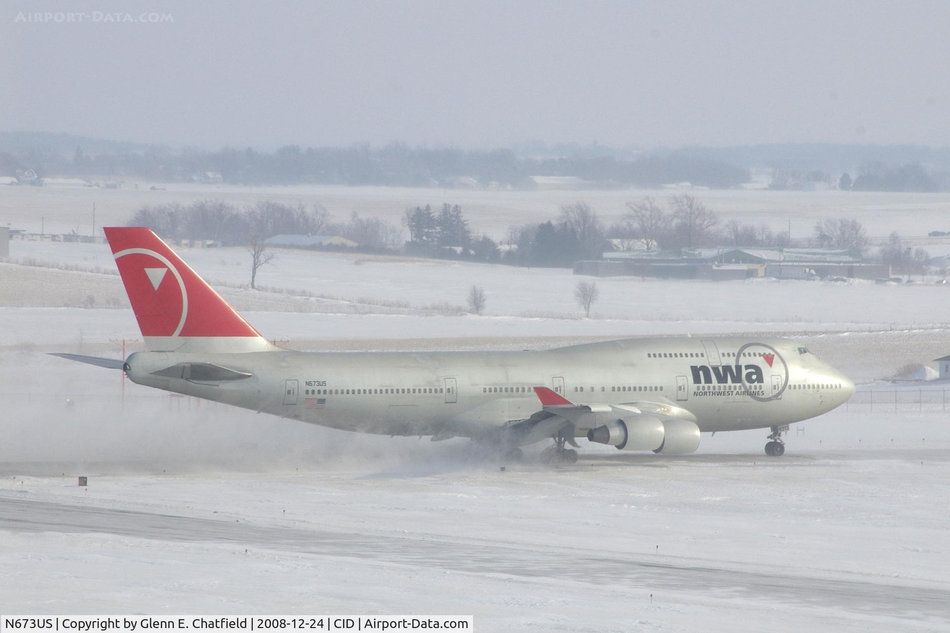 N673US, 1999 Boeing 747-451 C/N 30268, NWA9980 at Runway 27. Wind 280@25-30 kt and I'm outside on the tower catwalk