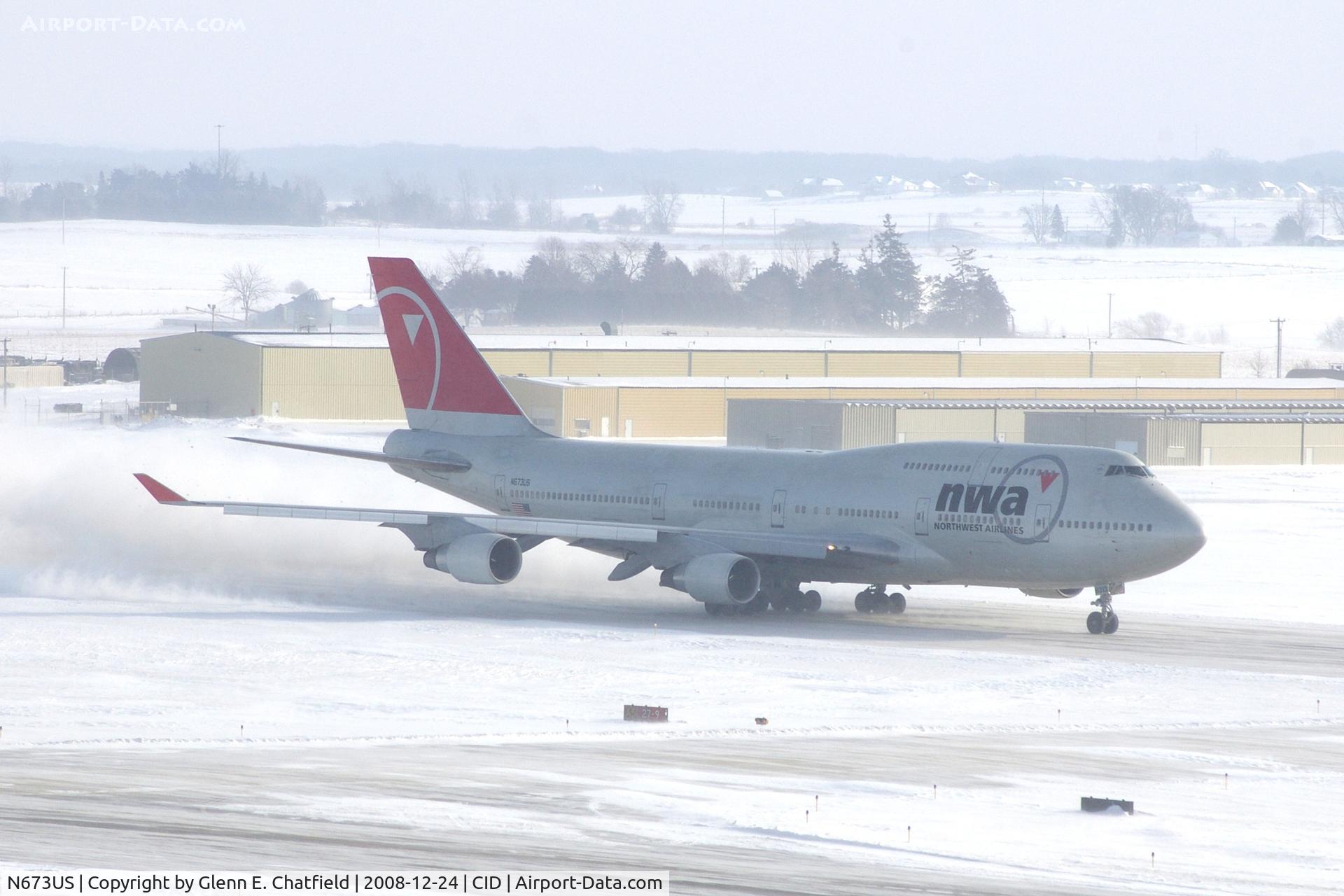 N673US, 1999 Boeing 747-451 C/N 30268, NWA9980 Runway 27 take-off roll. Wind 280@25-30 kt and I'm outside on the tower catwalk