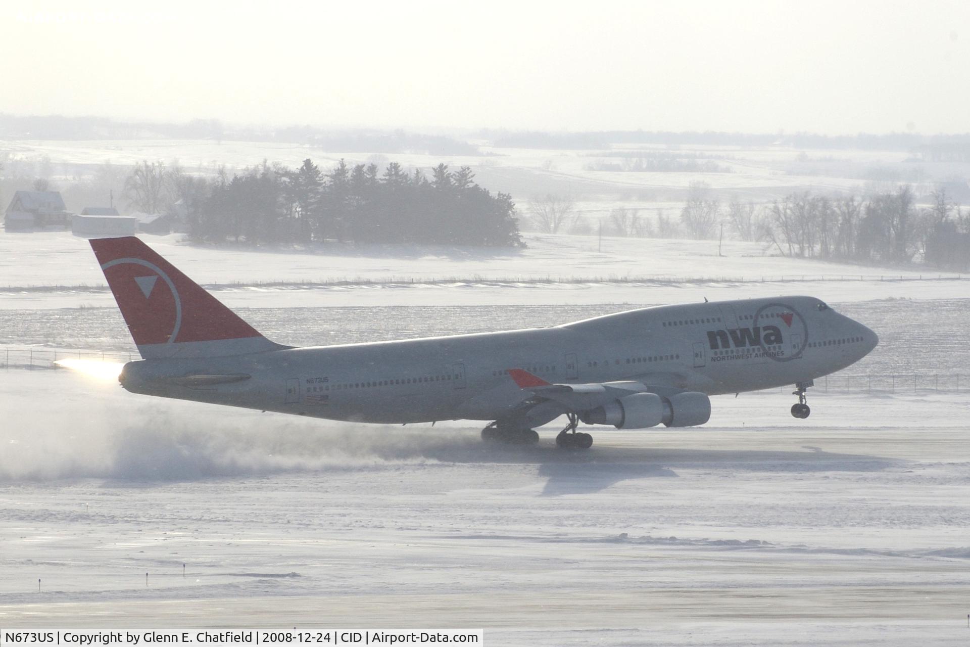 N673US, 1999 Boeing 747-451 C/N 30268, NW9980 about 2800 feet down the runway.  Wind 280@25-30 kts.  I'm glad I have my parka on!