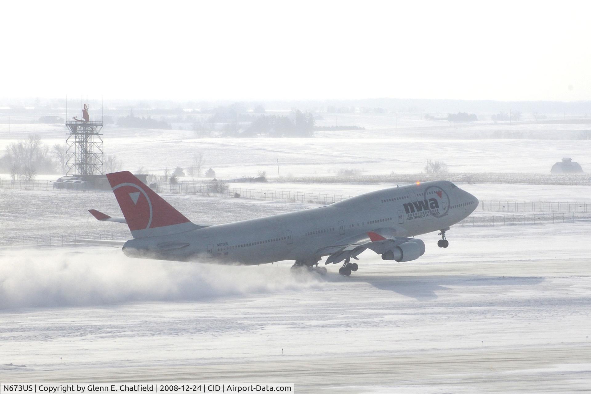 N673US, 1999 Boeing 747-451 C/N 30268, NW9980 about 3200 feet down the runway.  Wind 280@25-30 kts.  I'm glad I have my parka on!