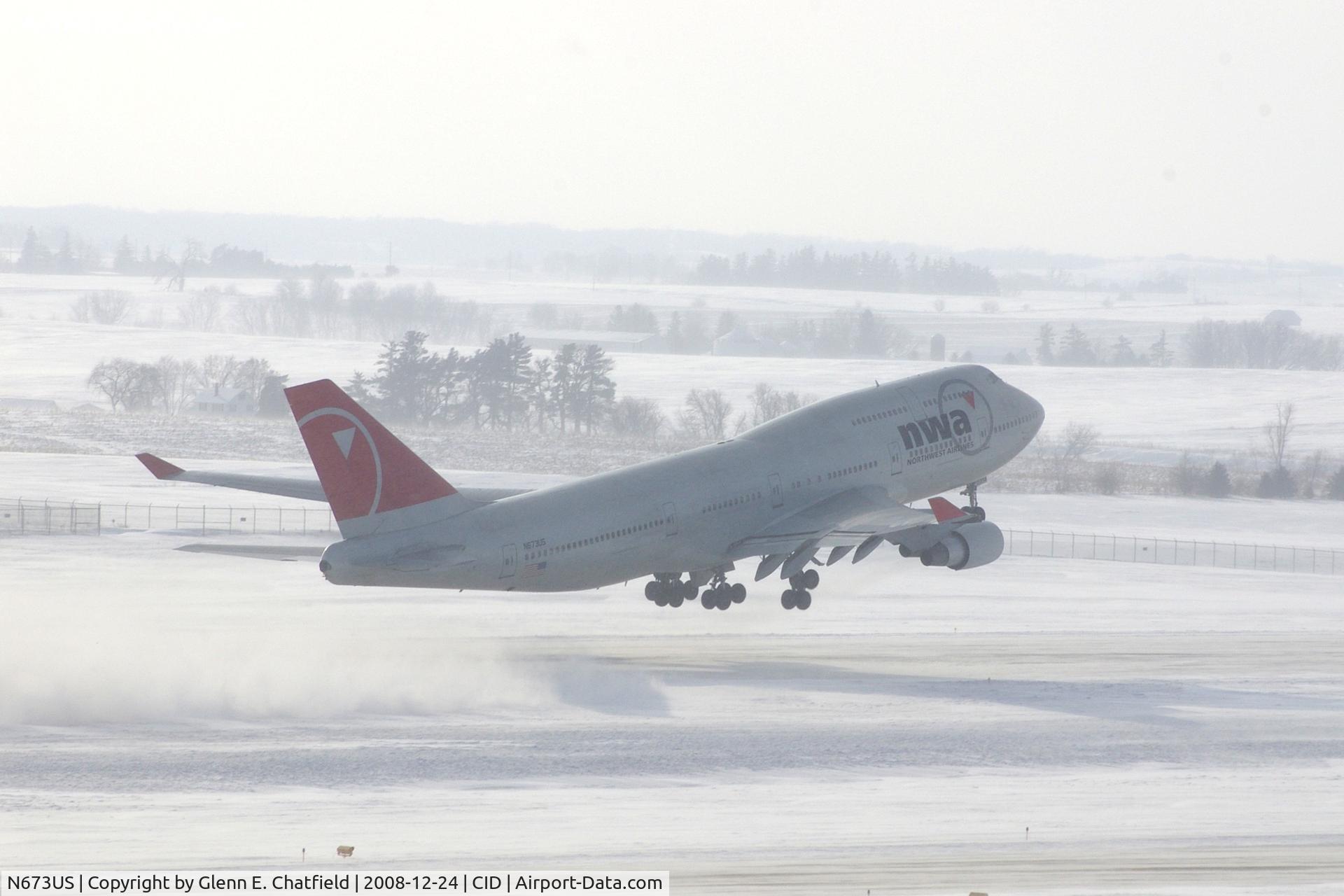 N673US, 1999 Boeing 747-451 C/N 30268, NW9980 about 4000 feet down the runway and airborne.  Wind 280@25-30 kts.  I'm glad I have my parka on!
