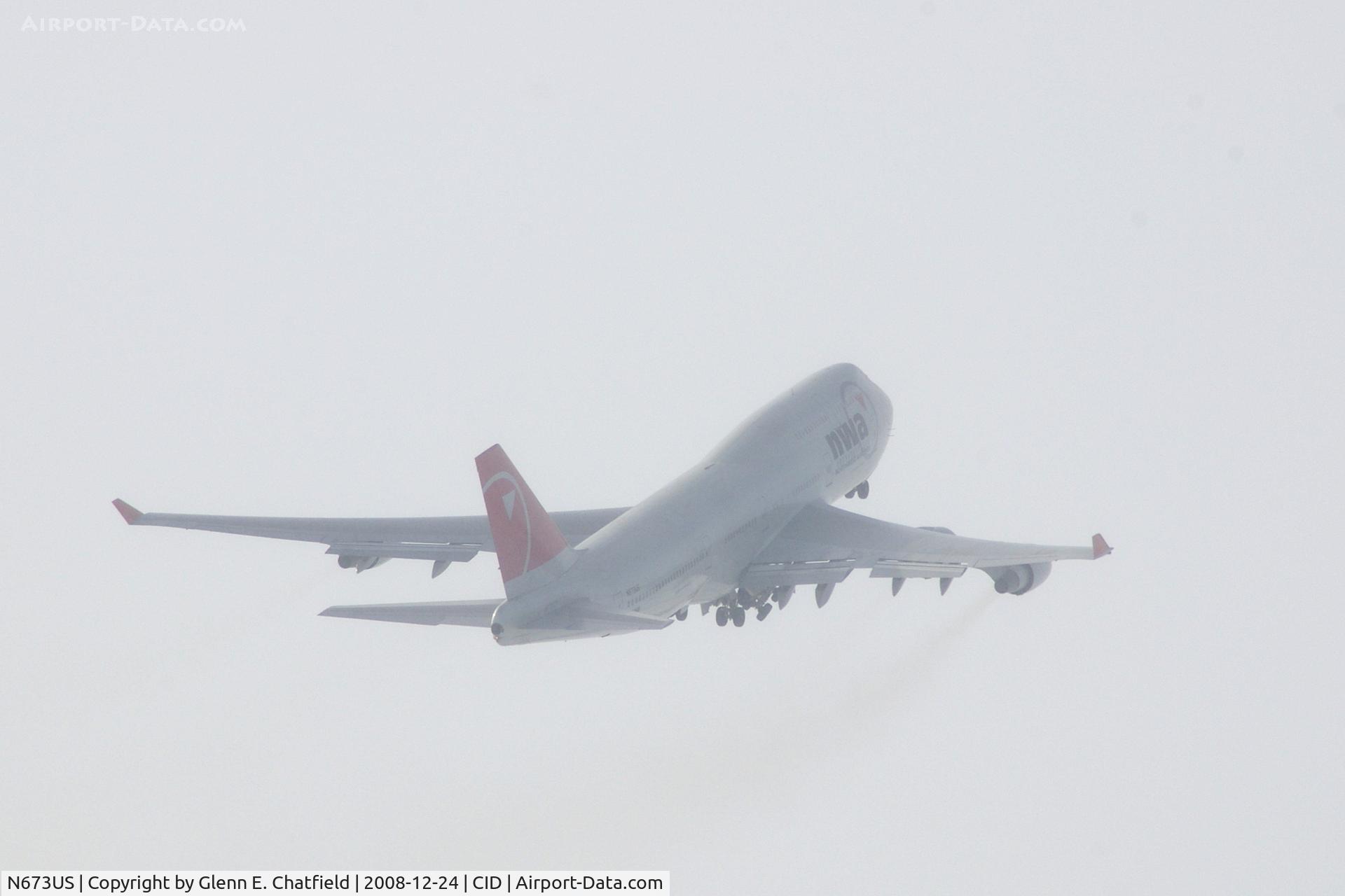N673US, 1999 Boeing 747-451 C/N 30268, NW9980 on the way to Tampa; landing gear almost retracted.  Looking into the sun