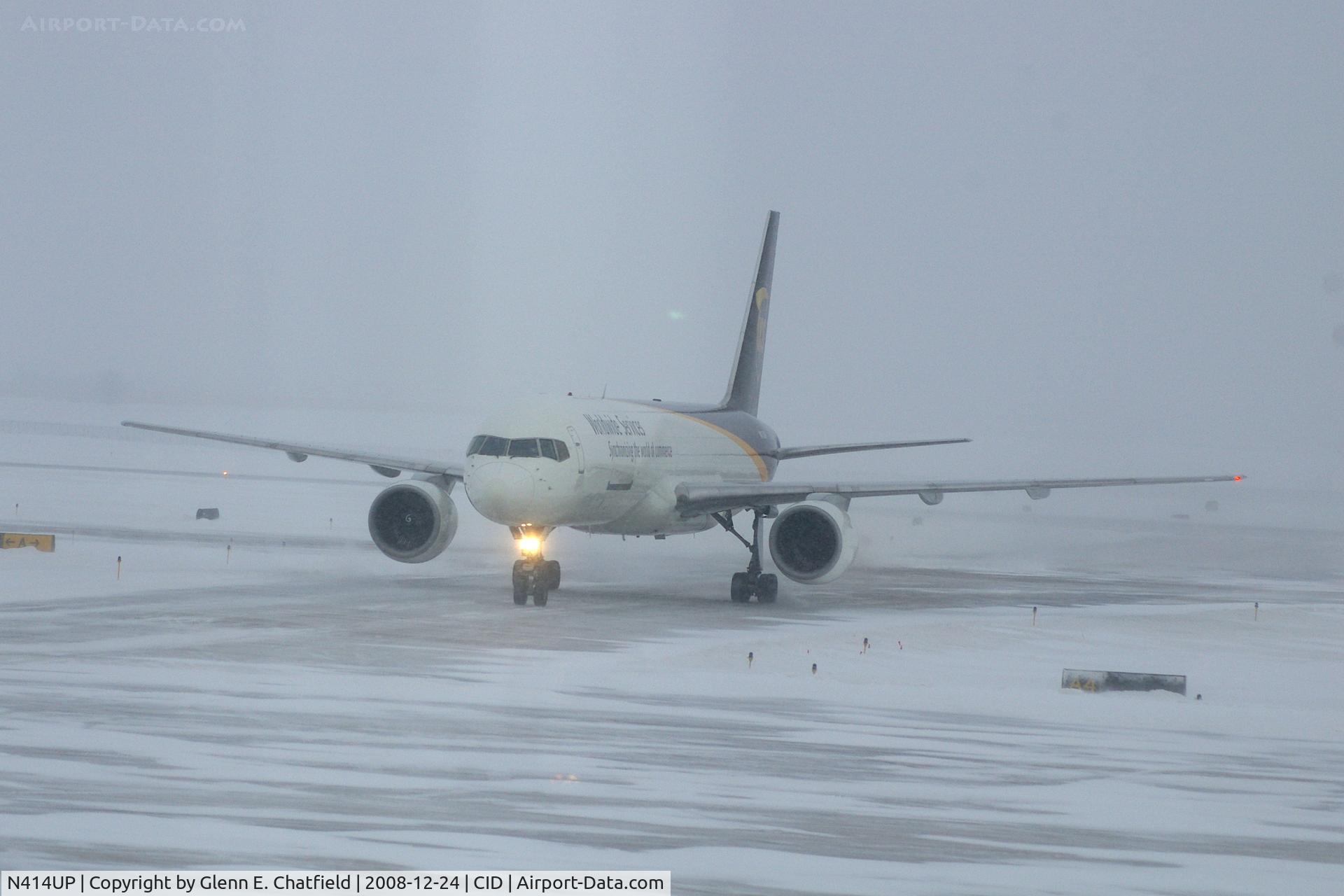 N414UP, 1988 Boeing 757-24APF C/N 23854, Taxiing to cargo ramp via Alpha 4.  Early morning in the snow.