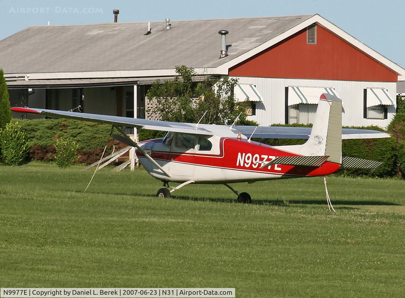 N9977E, 1958 Cessna 182A Skylane C/N 34853, This spiffy 1958 Skylane was parked by some houses at the edge of Kuztown Airport.