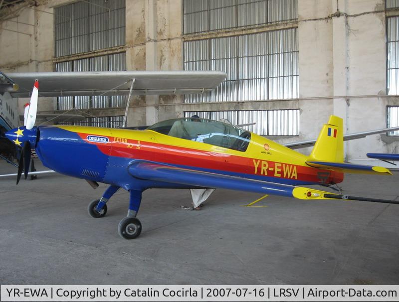 YR-EWA, 2004 Extra EA-300L C/N 1253, Resting in the hangar