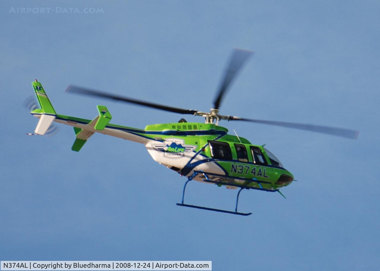 N374AL, 2008 Bell 407 C/N 53819, AirLife Denver heading NE over Columbine High School.