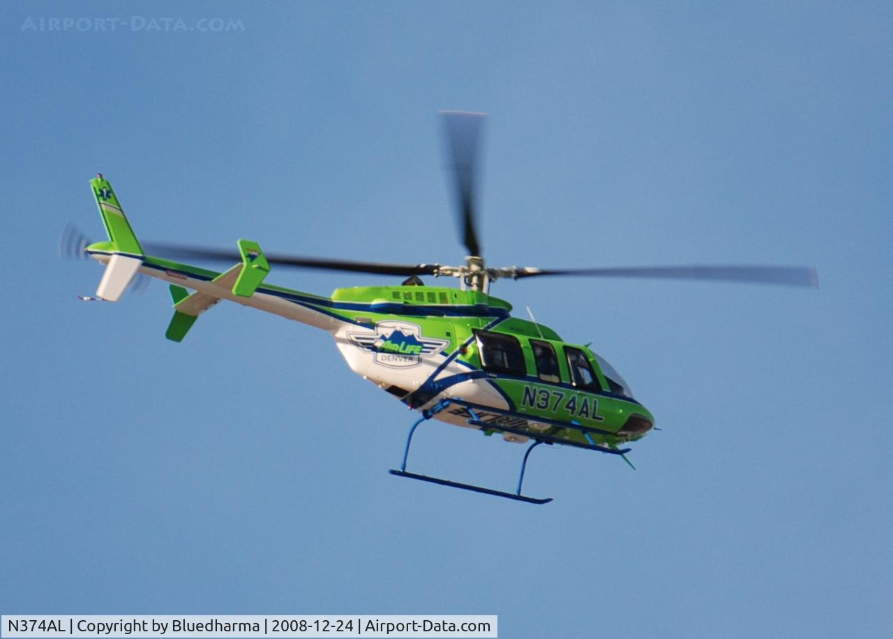 N374AL, 2008 Bell 407 C/N 53819, AirLife Denver heading NE over Columbine High School.