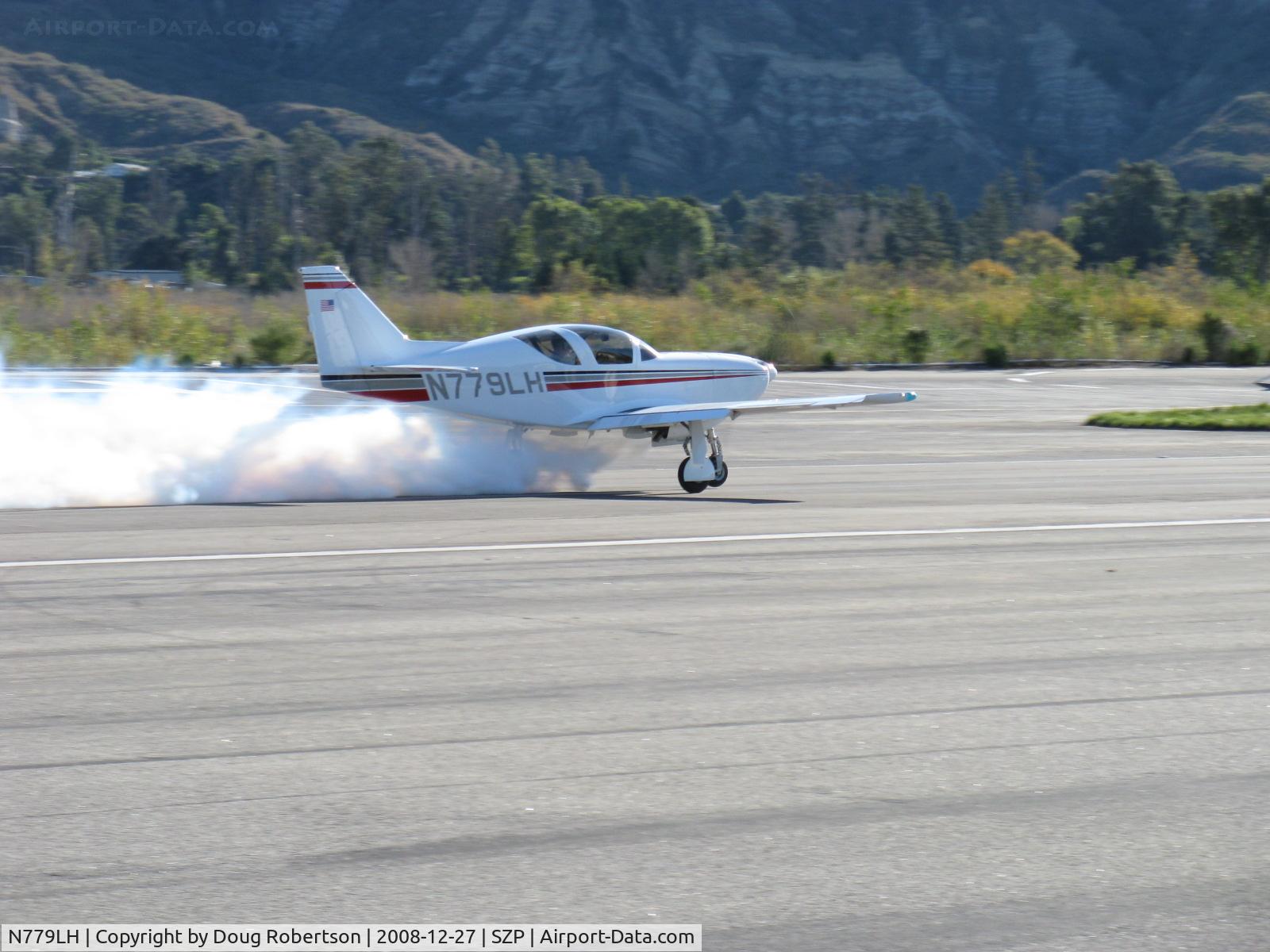 N779LH, 1991 Stoddard-Hamilton Glasair I RG C/N 779, 1991 Hendleman SHA GLASAIR 1 RG, Lycoming IO-360-B1E 180 Hp, takeoff Rwy 22 with airshow smoke. (It's not on fire)