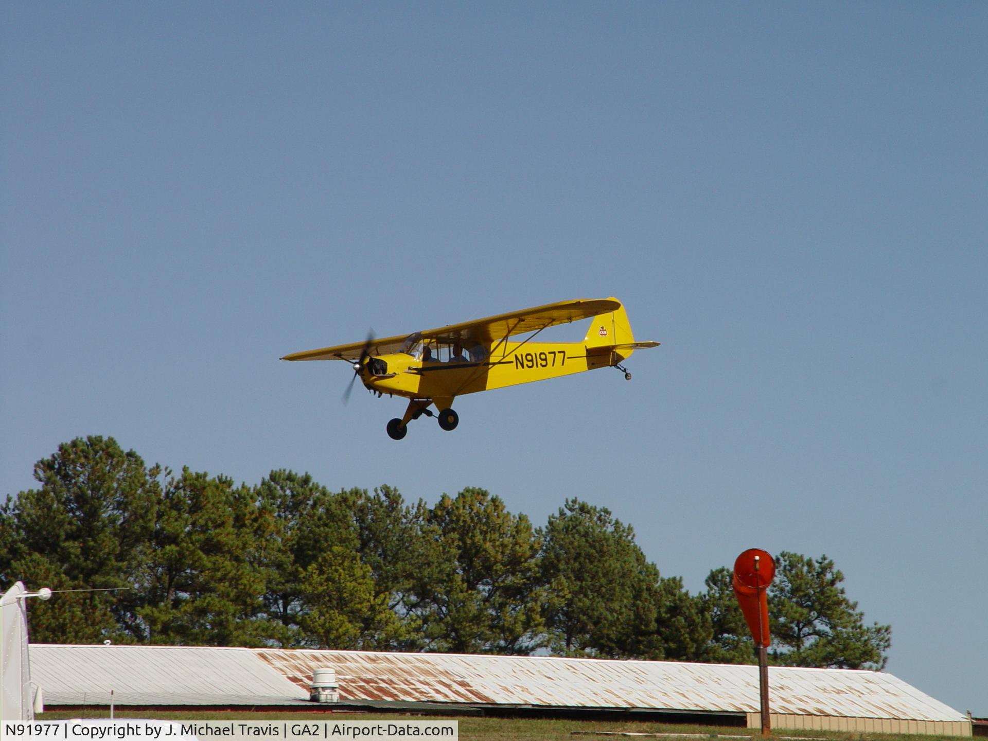 N91977, 1946 Piper J3C-65 Cub C/N 16408, N91977 on short final at Peachstate.