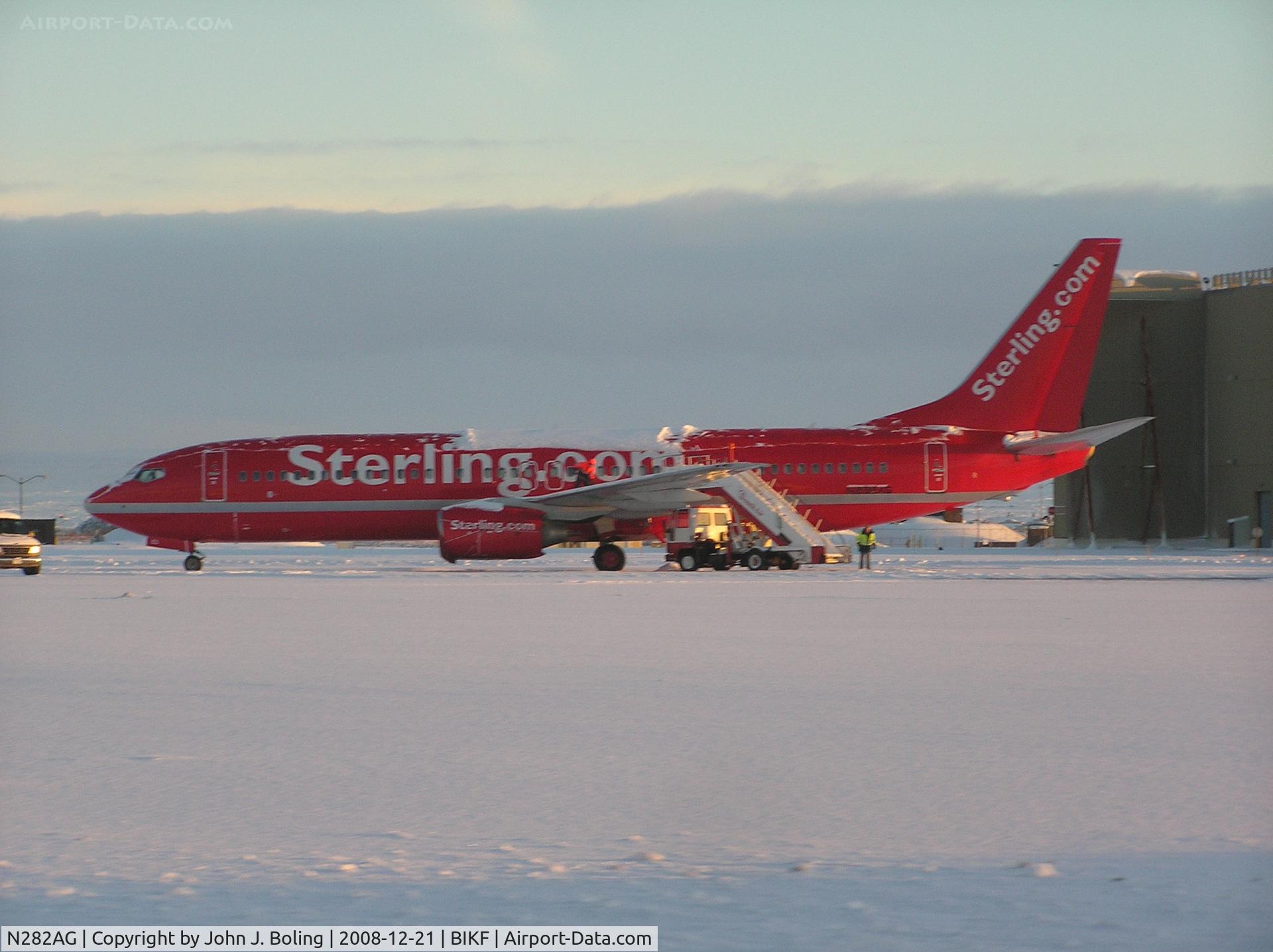 N282AG, 1999 Boeing 737-8Q8 C/N 28221, MSN 28221, Former Reg OY-SEC. Clearing snow on ramp at Keflavik prior to ferry to Duluth by Bruce Burns and John Boling.