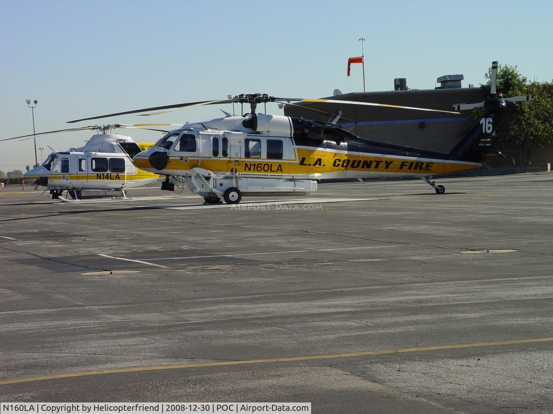 N160LA, 2000 Sikorsky S-70A Firehawk C/N 702453, Copter 14 and Copter 16 awaiting take off at EHA pad at Brackett