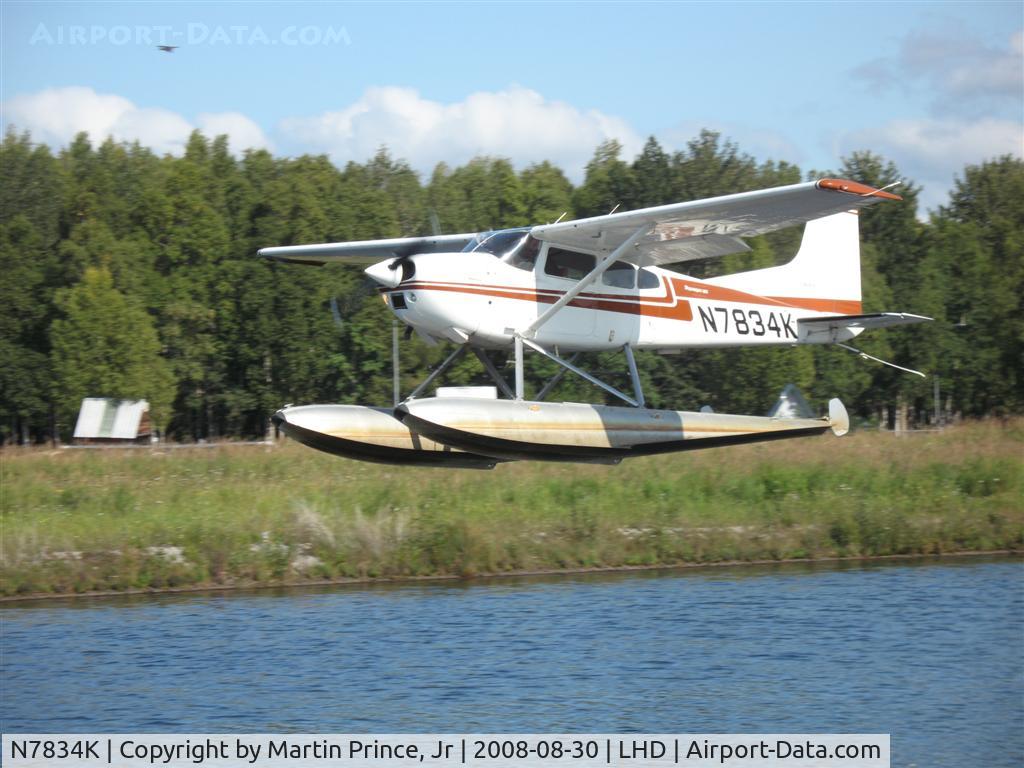 N7834K, 1976 Cessna 180J C/N 18052768, Taking off Lake Hood