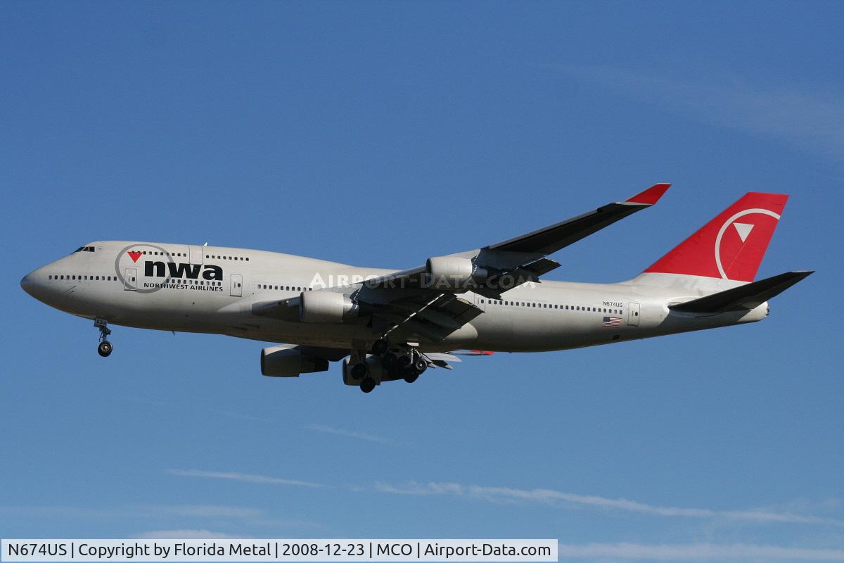 N674US, 1999 Boeing 747-451 C/N 30269, Northwest 747-400 bringing Wisconsin Badgers to Orlando to play the Champs Sports Bowl