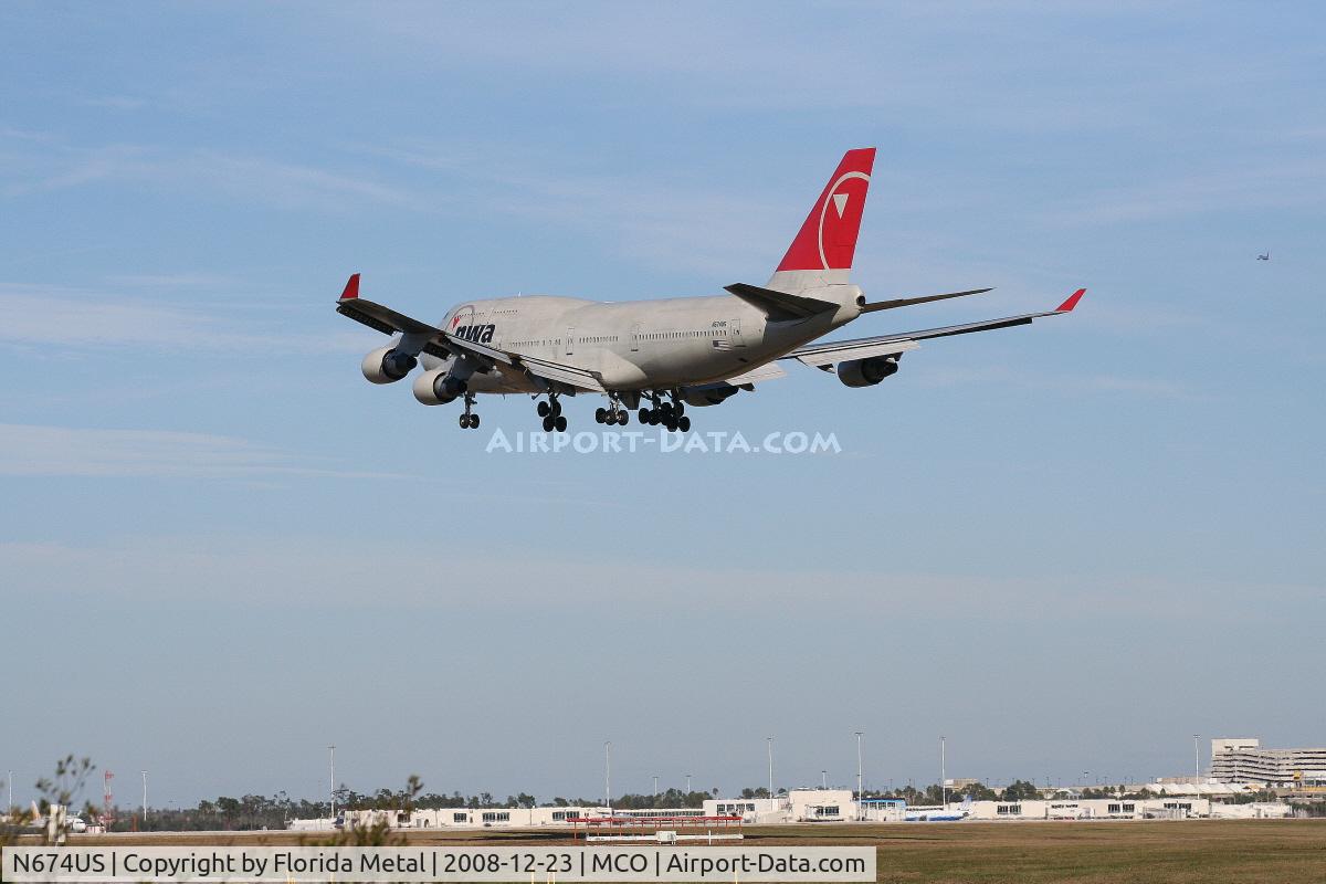 N674US, 1999 Boeing 747-451 C/N 30269, Northwest 747-400 bringing Wisconsin Badgers to Orlando to play the Champs Sports Bowl