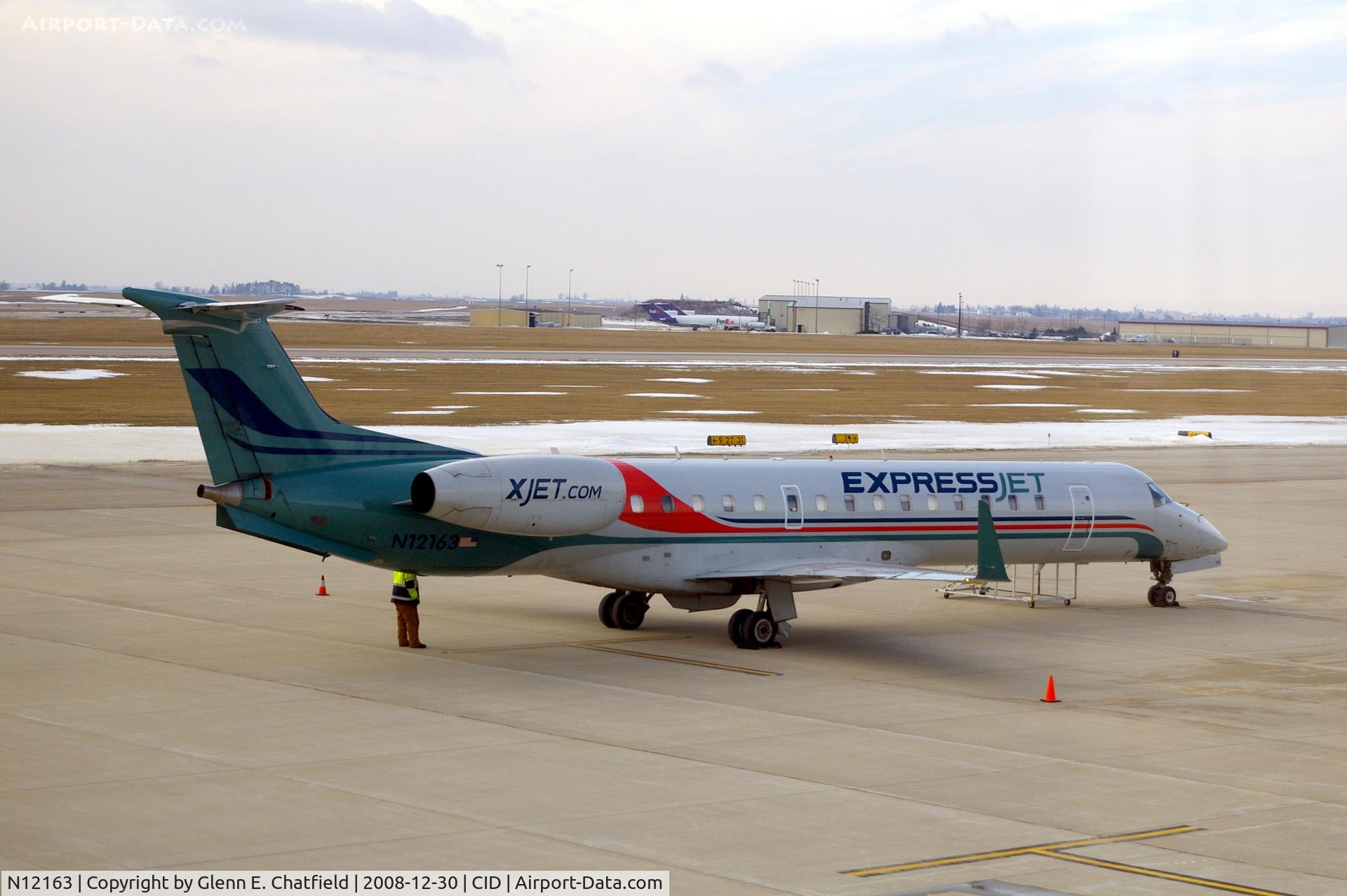 N12163, 2004 Embraer ERJ-145XR (EMB-145XR) C/N 14500811, Charter, in front of Landmark FBO, seen from my tower office
