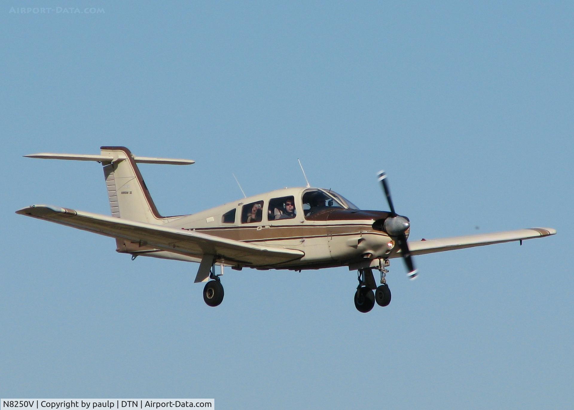 N8250V, 1980 Piper PA-28RT-201 Arrow IV C/N 28R-8018099, Landing at Downtown Shreveport. Notice I am getting my picture taken by the backseater.