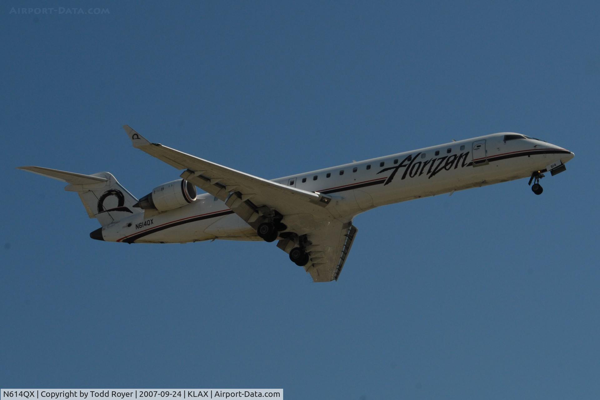 N614QX, 2002 Bombardier CRJ-701 (CL-600-2C10) Regional Jet C/N 10049, Landing 24R at LAX