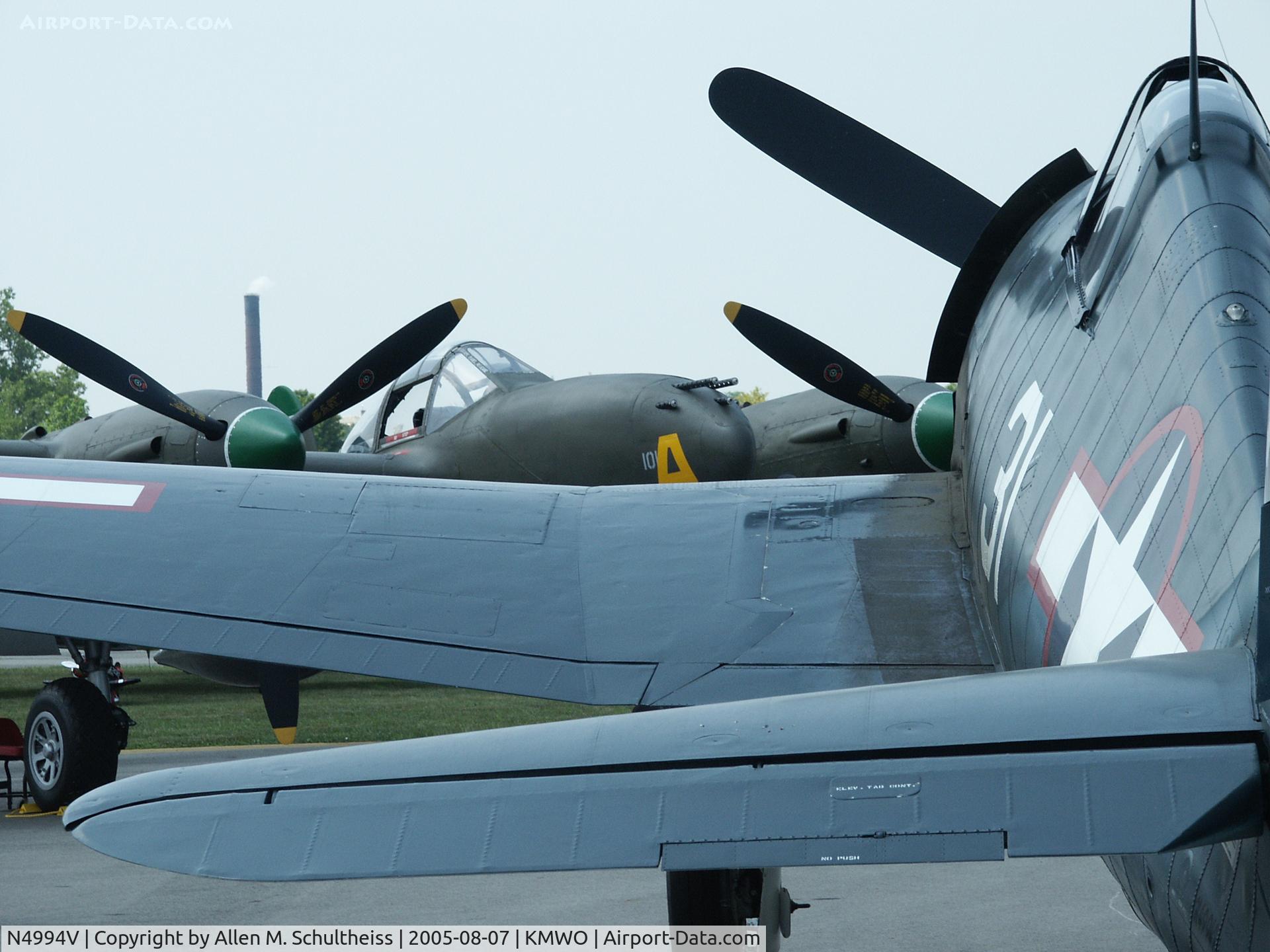N4994V, 1944 Grumman F6F-5 Hellcat C/N A-11631 (USN93879), On display with Porky II, a P38J (N138AM)