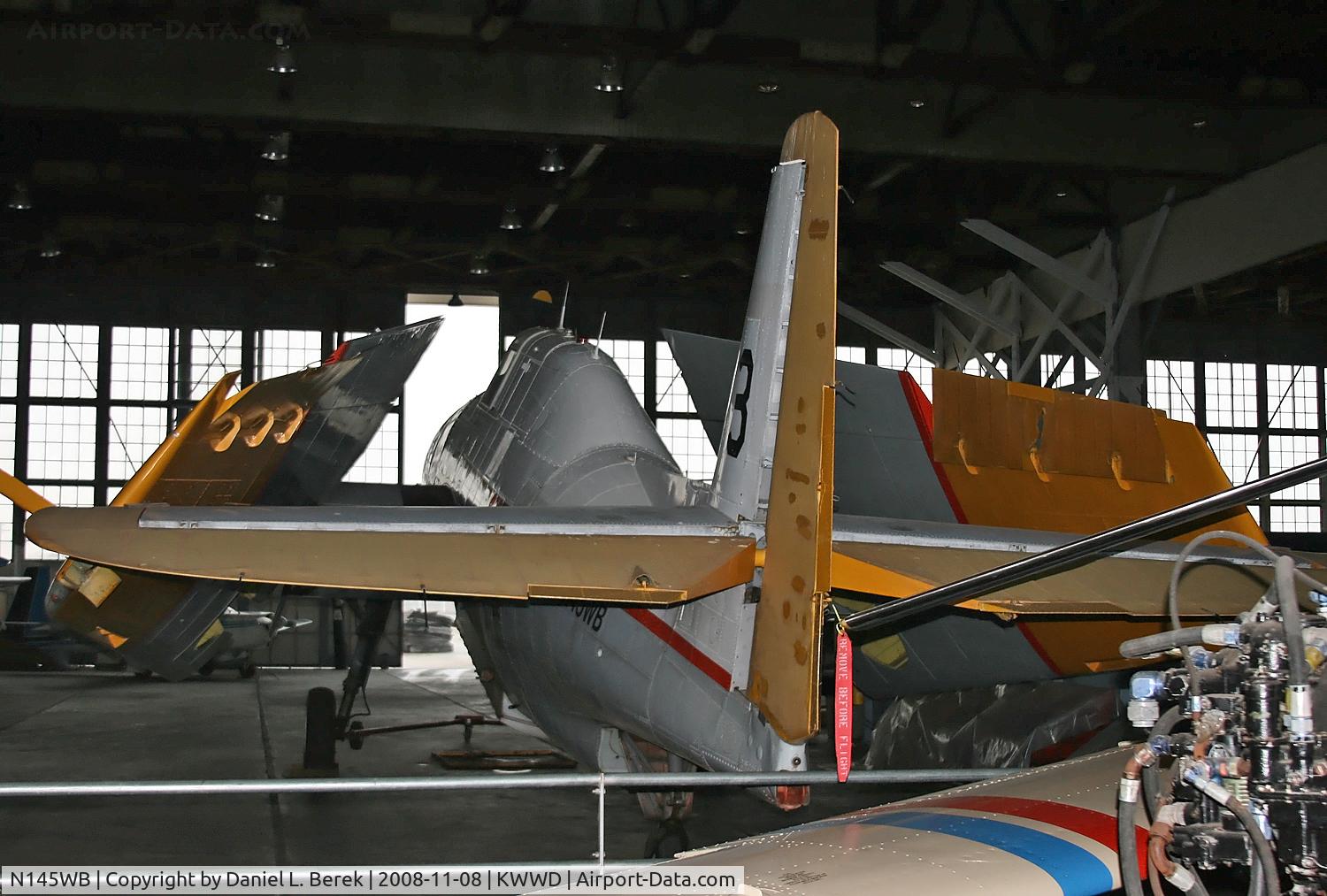 N145WB, 1945 Grumman TBM-3E Avenger C/N 85460, Normally enjoying the great outdoors, this old Avenger takes shelter with other Navy aircraft in the great hangar at NAS Wildwood on a dreary day.