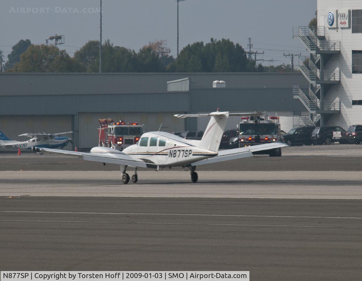 N877SP, 1980 Beech 76 Duchess C/N ME-310, N877SP arriving on RWY 21 with the left engine shut down and the prop feathered. Santa Monica Airport Fire Rescue is on standby in the background.
