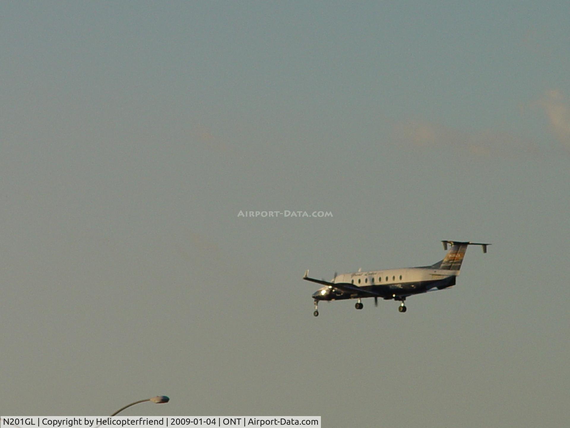 N201GL, 1996 Beech 1900D C/N UE-201, Crossing the outer fence of Ontario