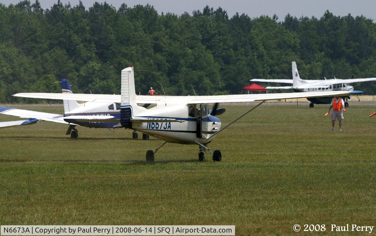 N6673A, 1956 Cessna 172 C/N 28773, Cooling her wheels on the grass