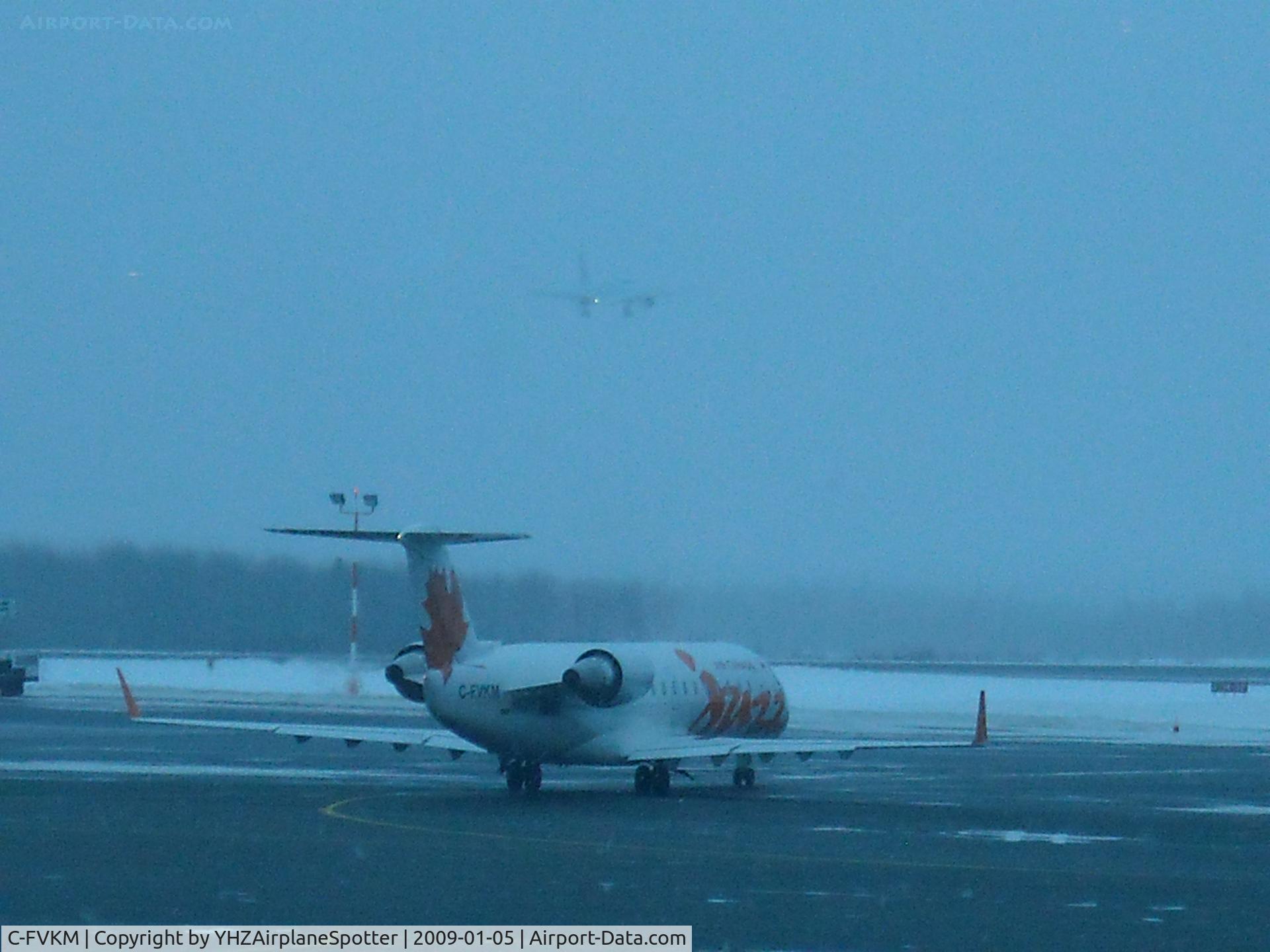 C-FVKM, 1995 Canadair CRJ-100ER (CL-600-2B19) C/N 7074, Air Canada Jazz C-FVKM standsby as Air Canada C-GBIA prepares to land at YHZ