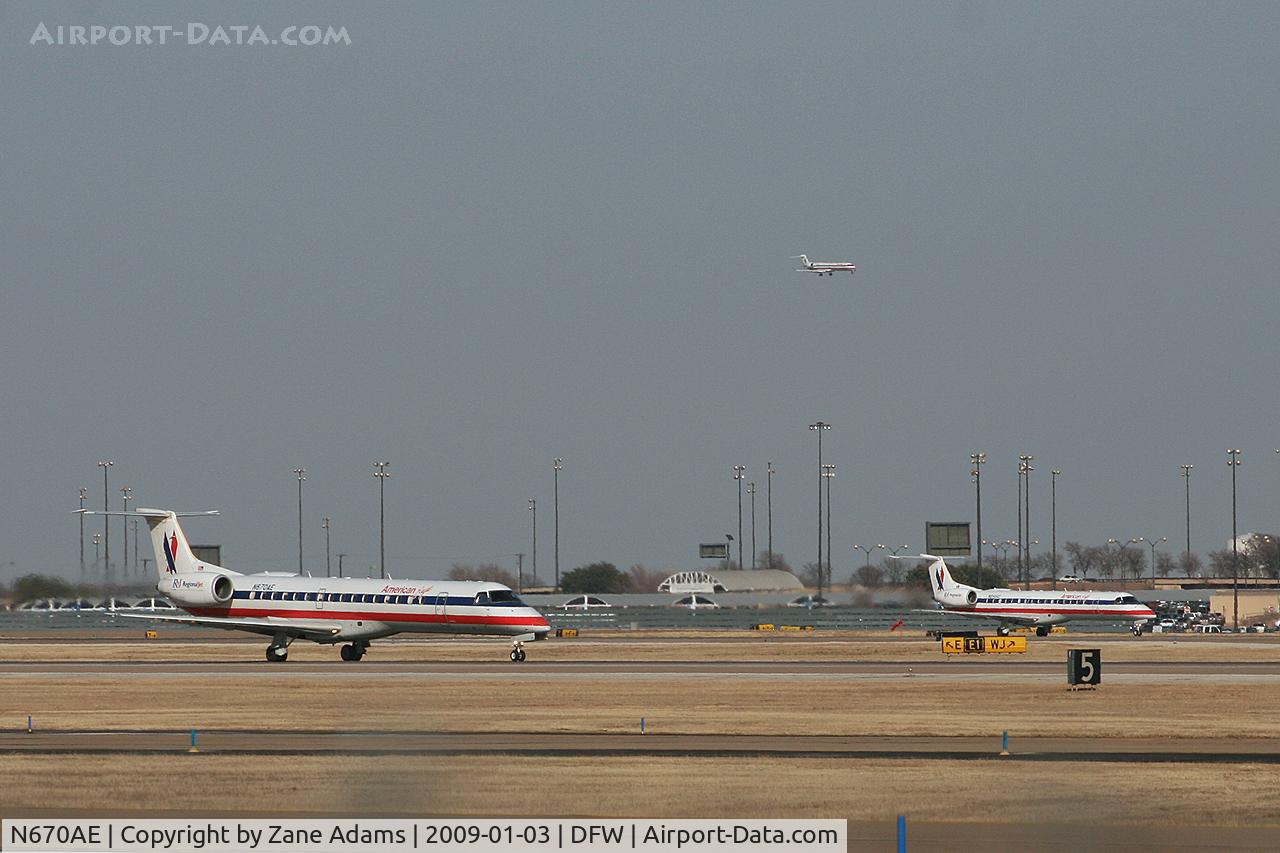 N670AE, 2004 Embraer ERJ-145LR (EMB-145LR) C/N 145790, American Eagle at DFW - One landing and one departing on the west side while one lands on the east side.