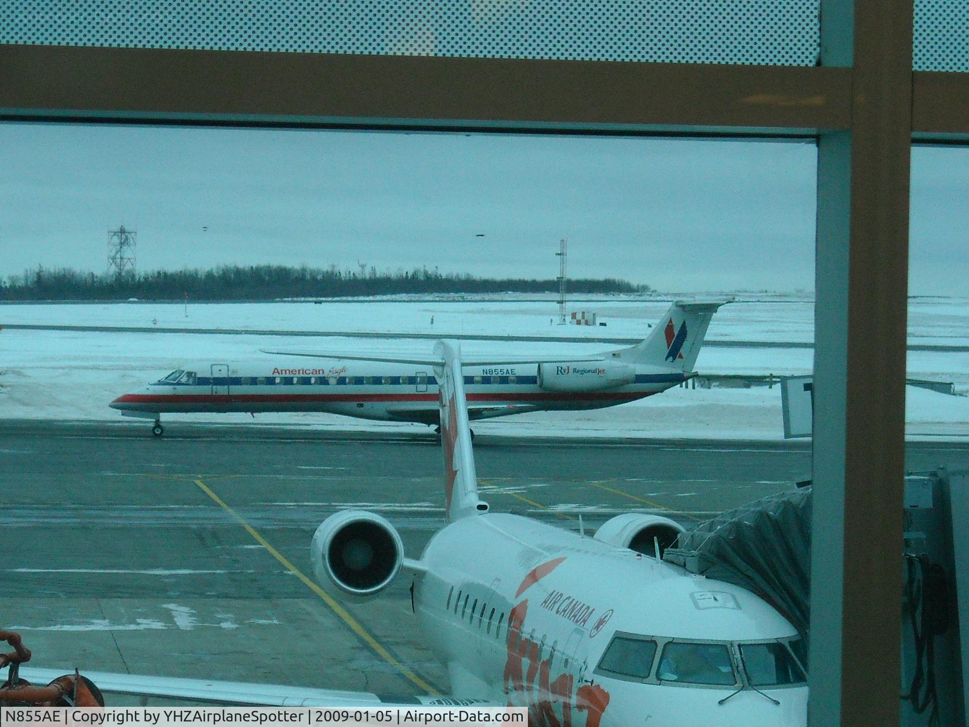 N855AE, 2003 Embraer ERJ-140LR (EMB-135KL) C/N 145747, American Eagle flight arriving at YHZ proceeding to gate